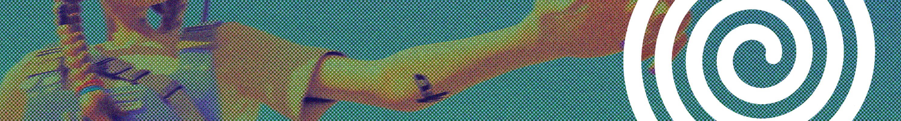 A thoughtful young person with dark hair gazes to the side, captured in soft black and white lighting.