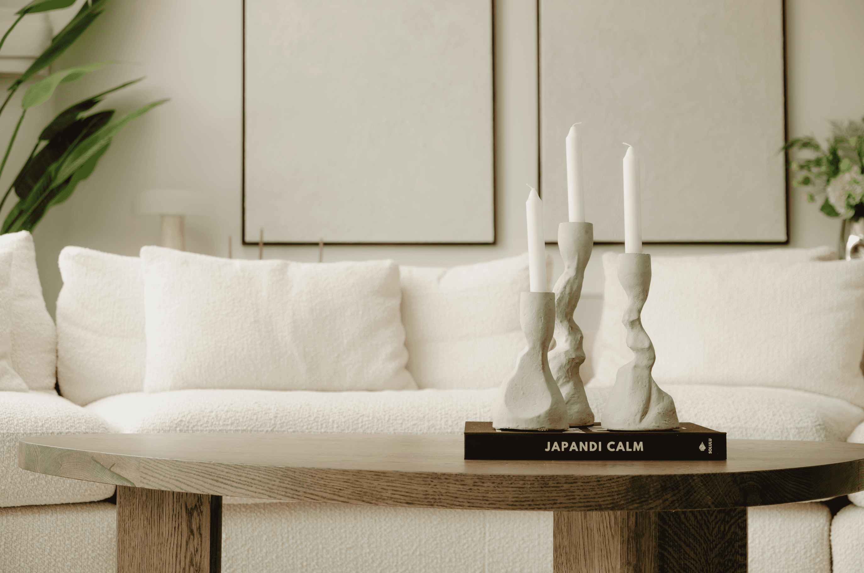 A mysteriously smiling woman covers her face with a newspaper