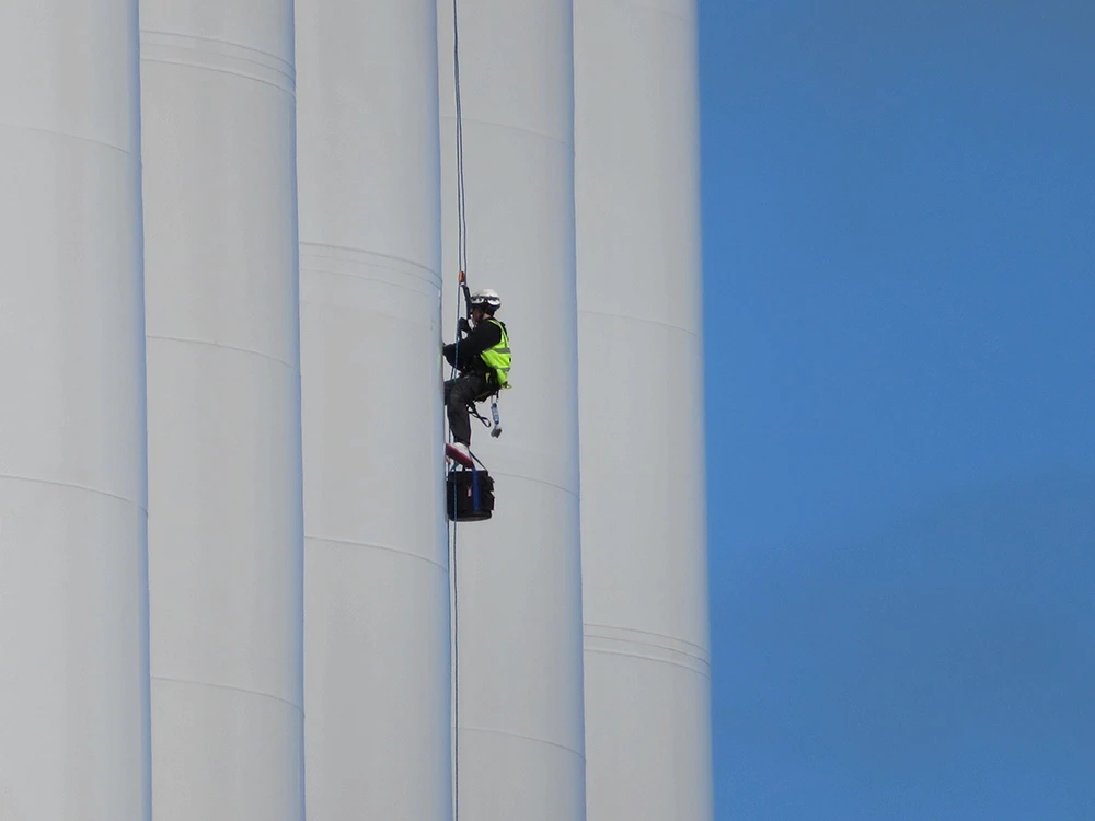 Project team working at height on a wind turbine structure.