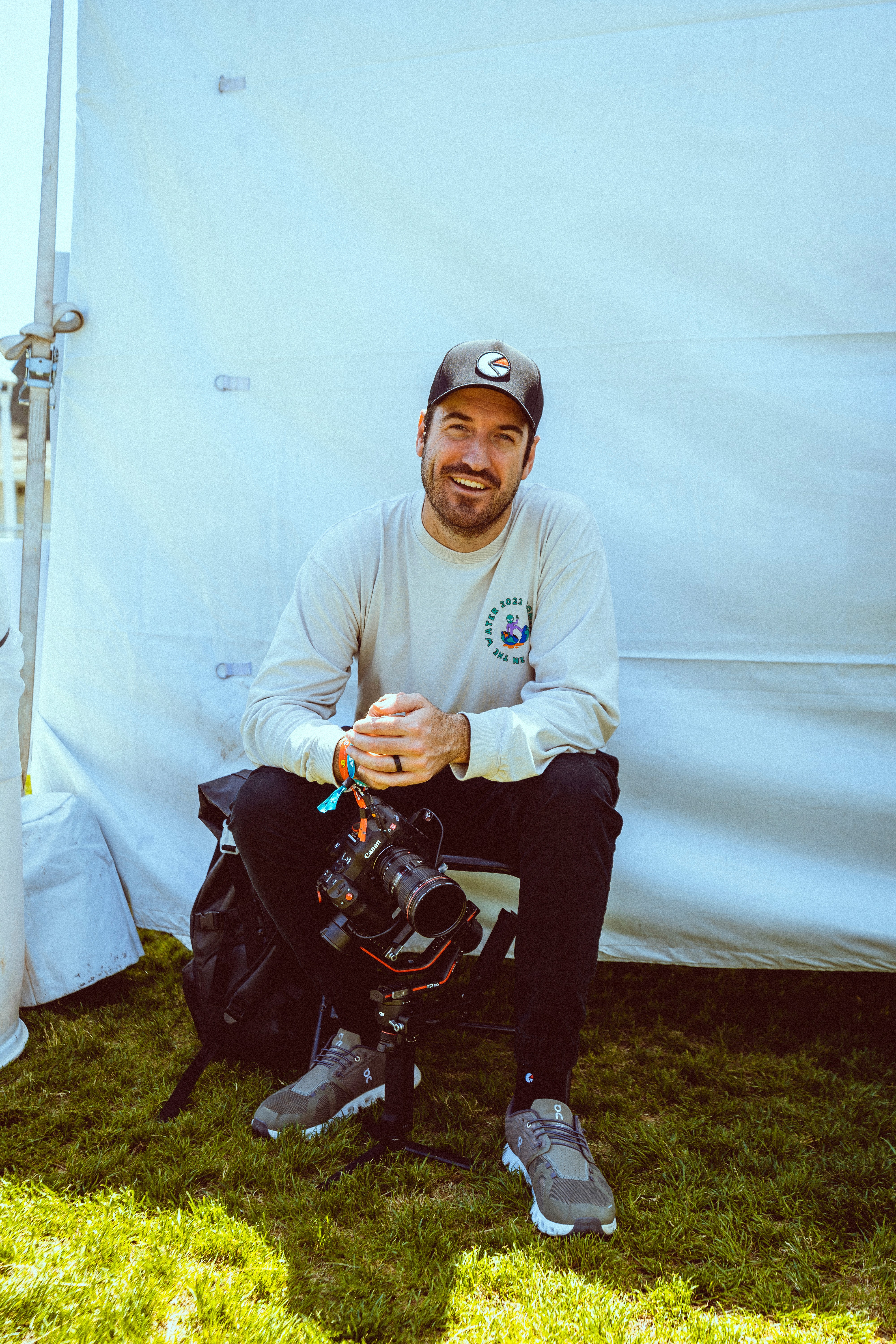 woman looking away and wearing a camera