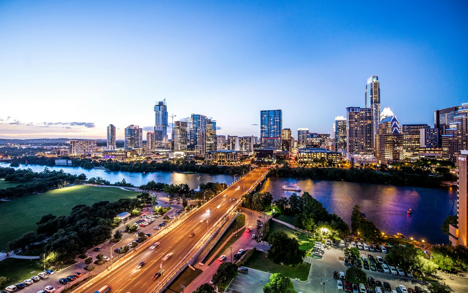 Austin city skyline reflected in the water of Lady Bird Lake at twilight