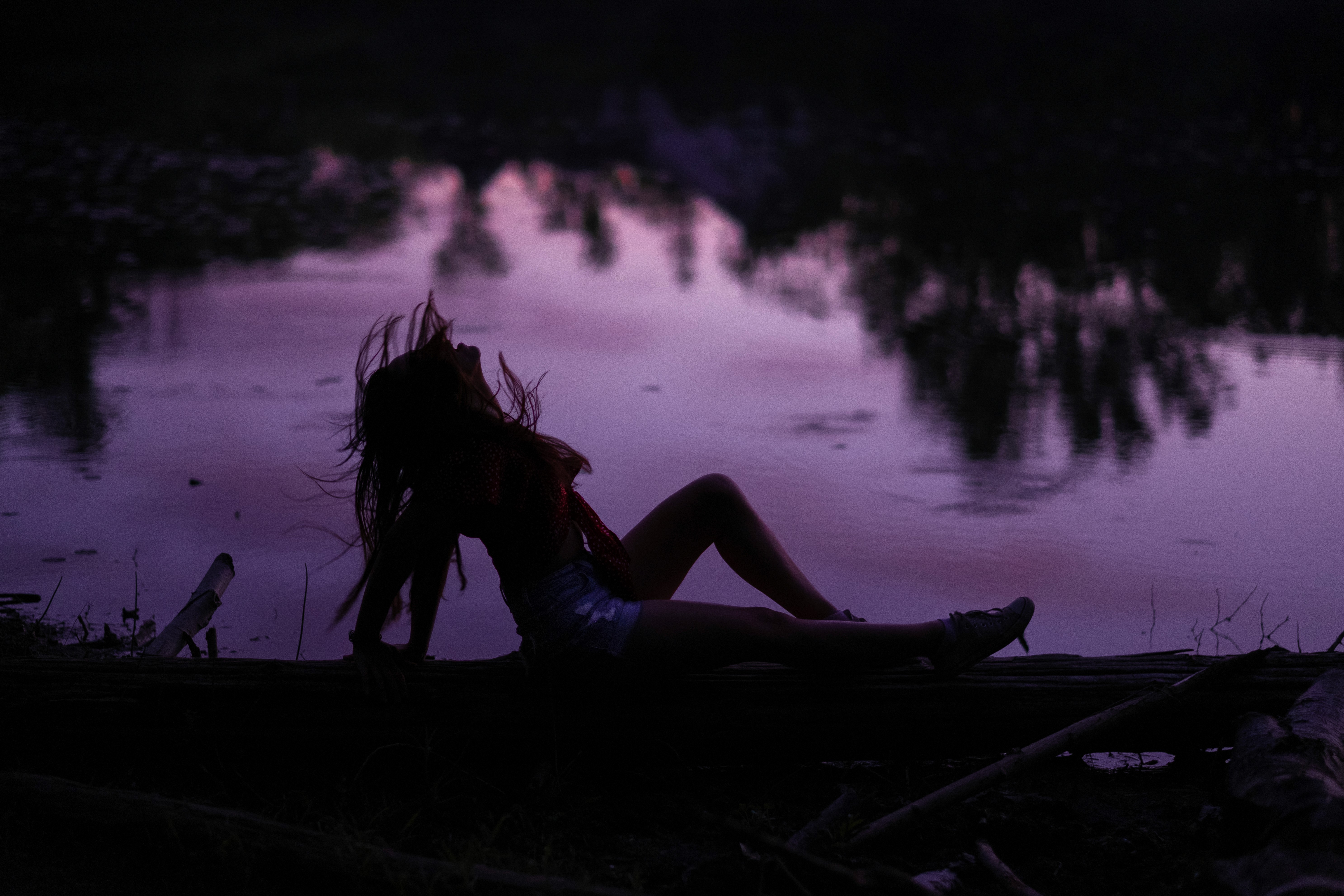 a woman holding a red flower
