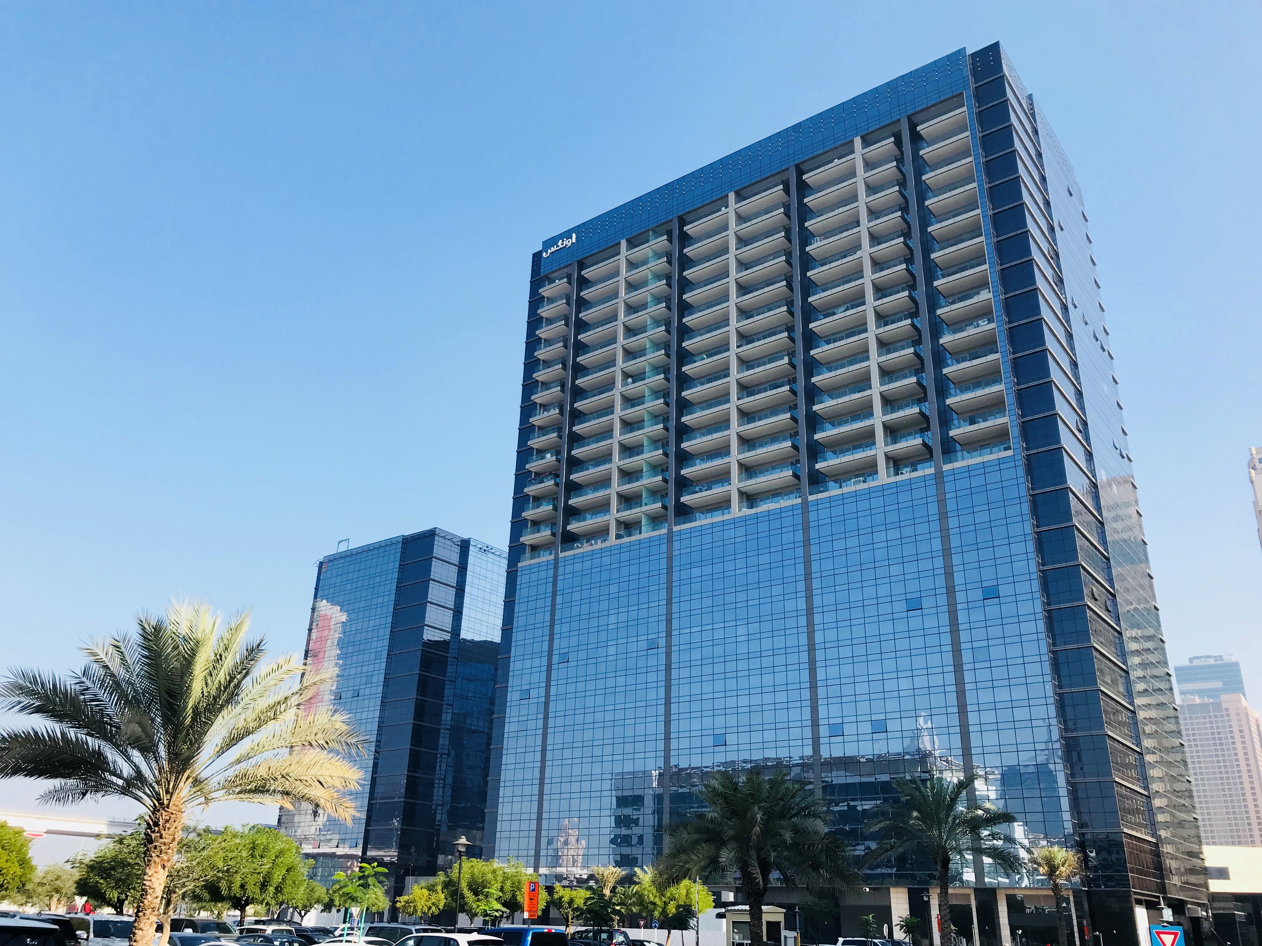 Panoramic view of a prominent city building. Real estate experts for buying, selling, or leasing property.