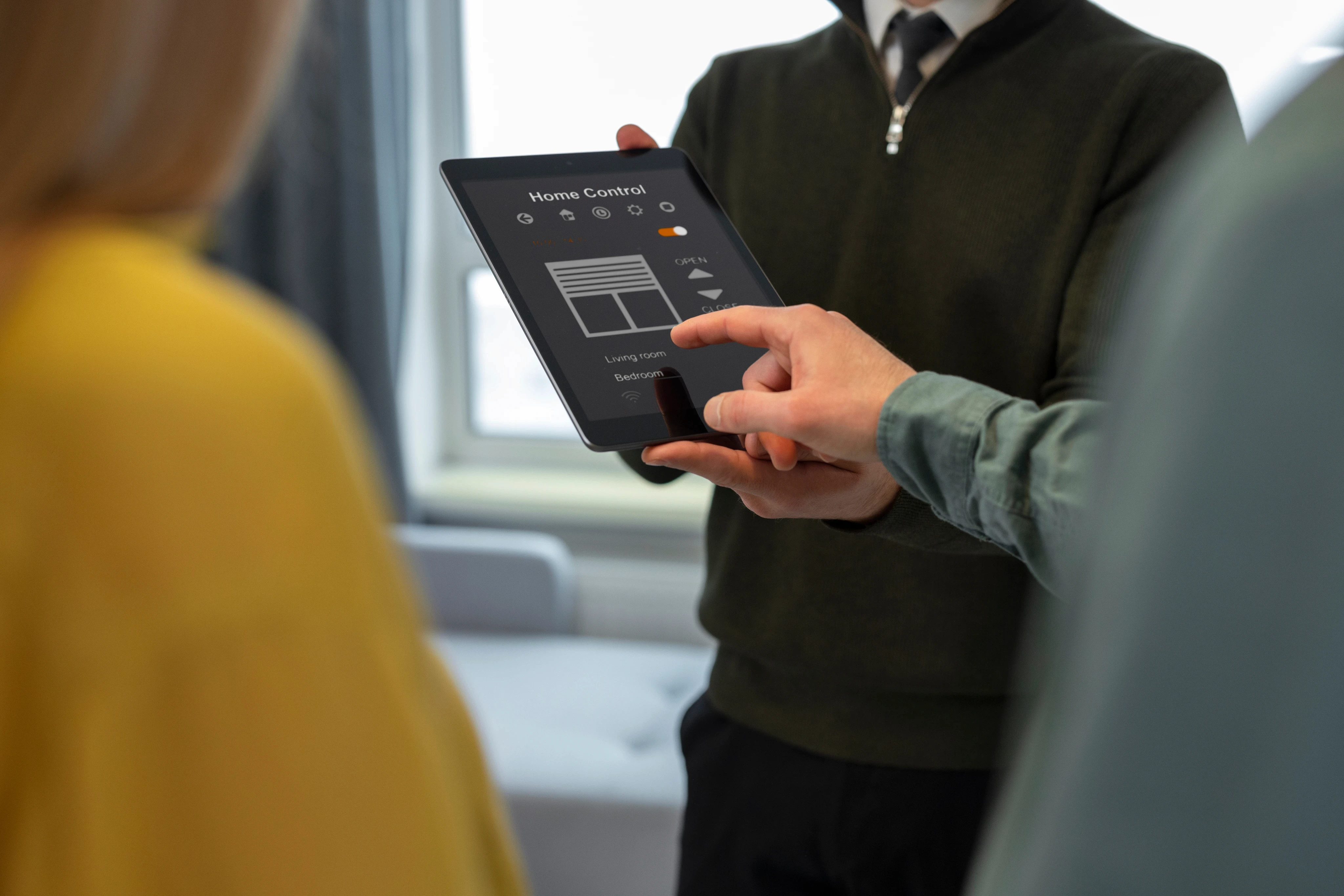 Close-up of a hand holding a smartphone device with a mobile app interface.