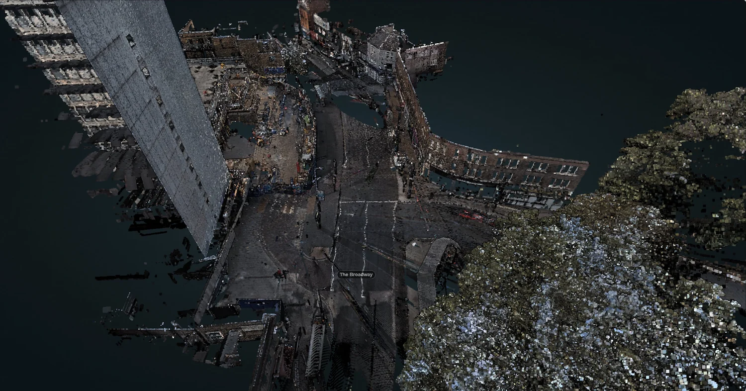 Detailed 3D point cloud model of an urban streetscape and building facades, generated from high-density laser scan data