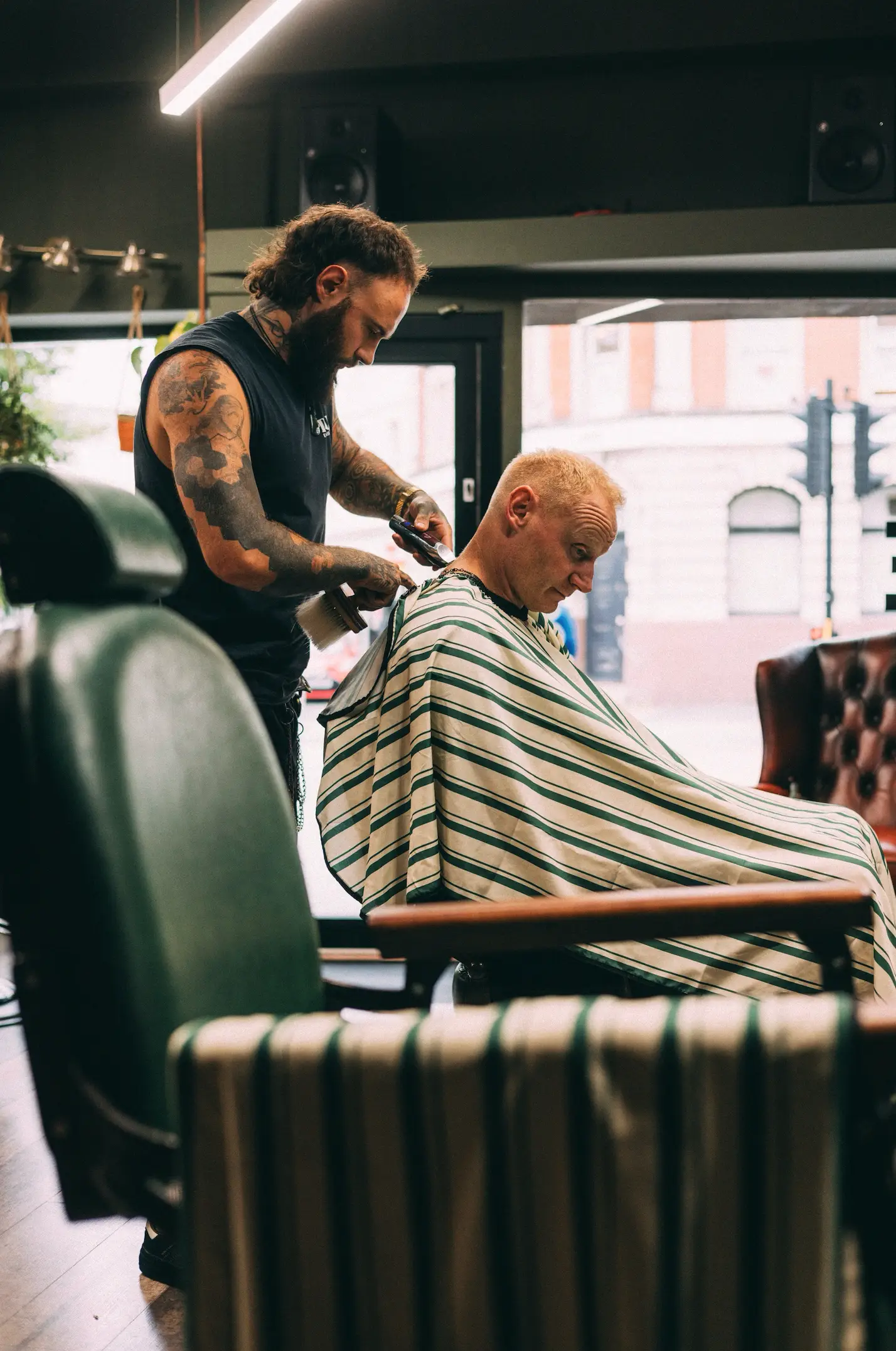 Male Barber Cutting a Males Hair.