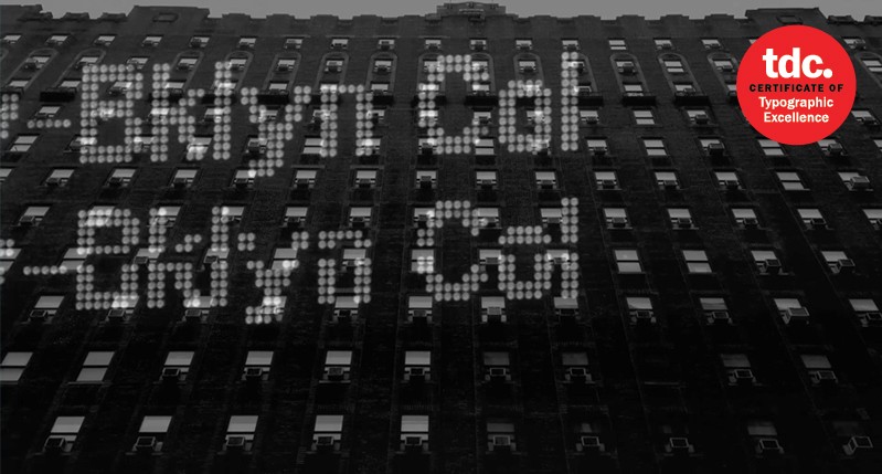 A poster showing a black and white photo of a multistore building. Also there is some gray dottet text: Bklyn Col.