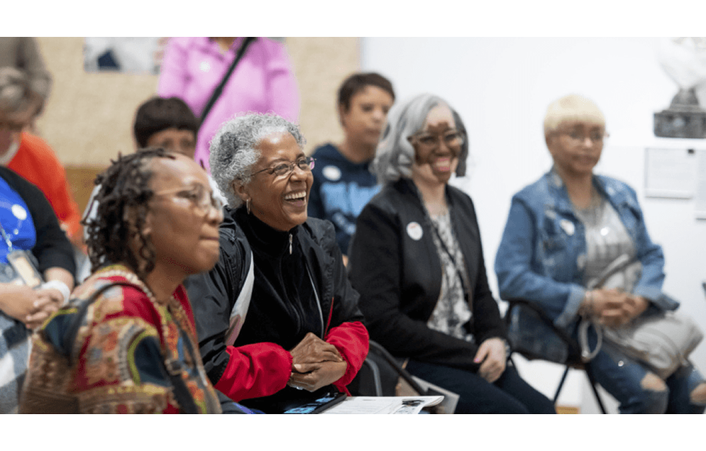 Group of diverse women laughing and smiling together. Enjoying an event.