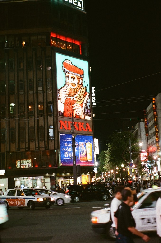 a cell phone leaning on a ledge