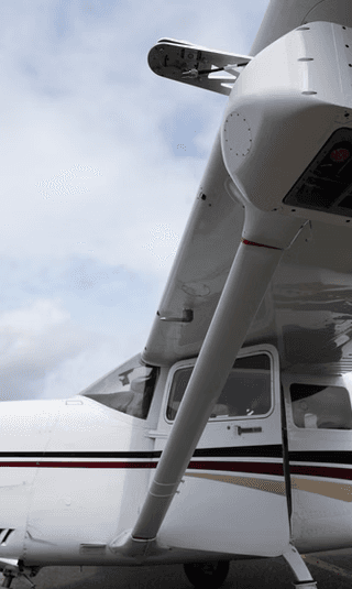 Overwatch Imaging sensor mounted high on the wing strut of a light aircraft