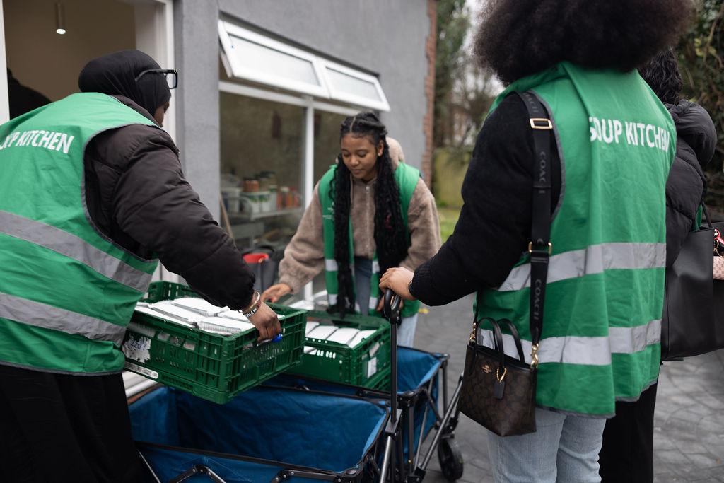 a group of children sitting on steps in front of a building