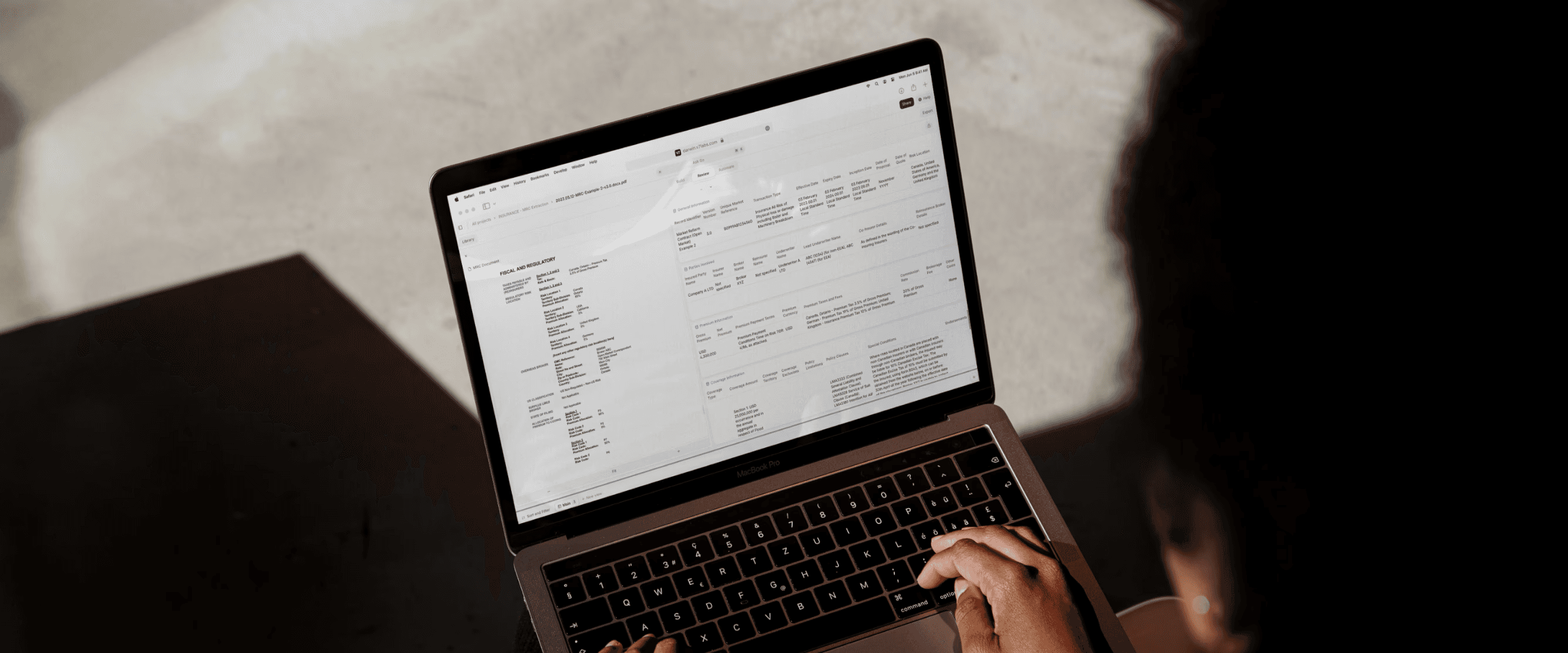 Image of person looking at claims document on laptop