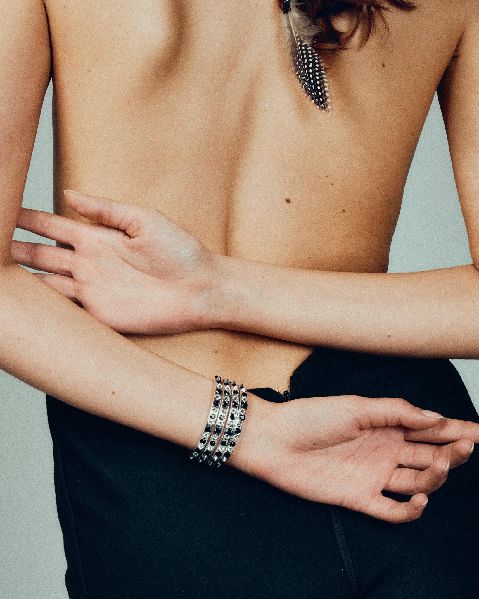 Girl lying on the ground with a skateboard