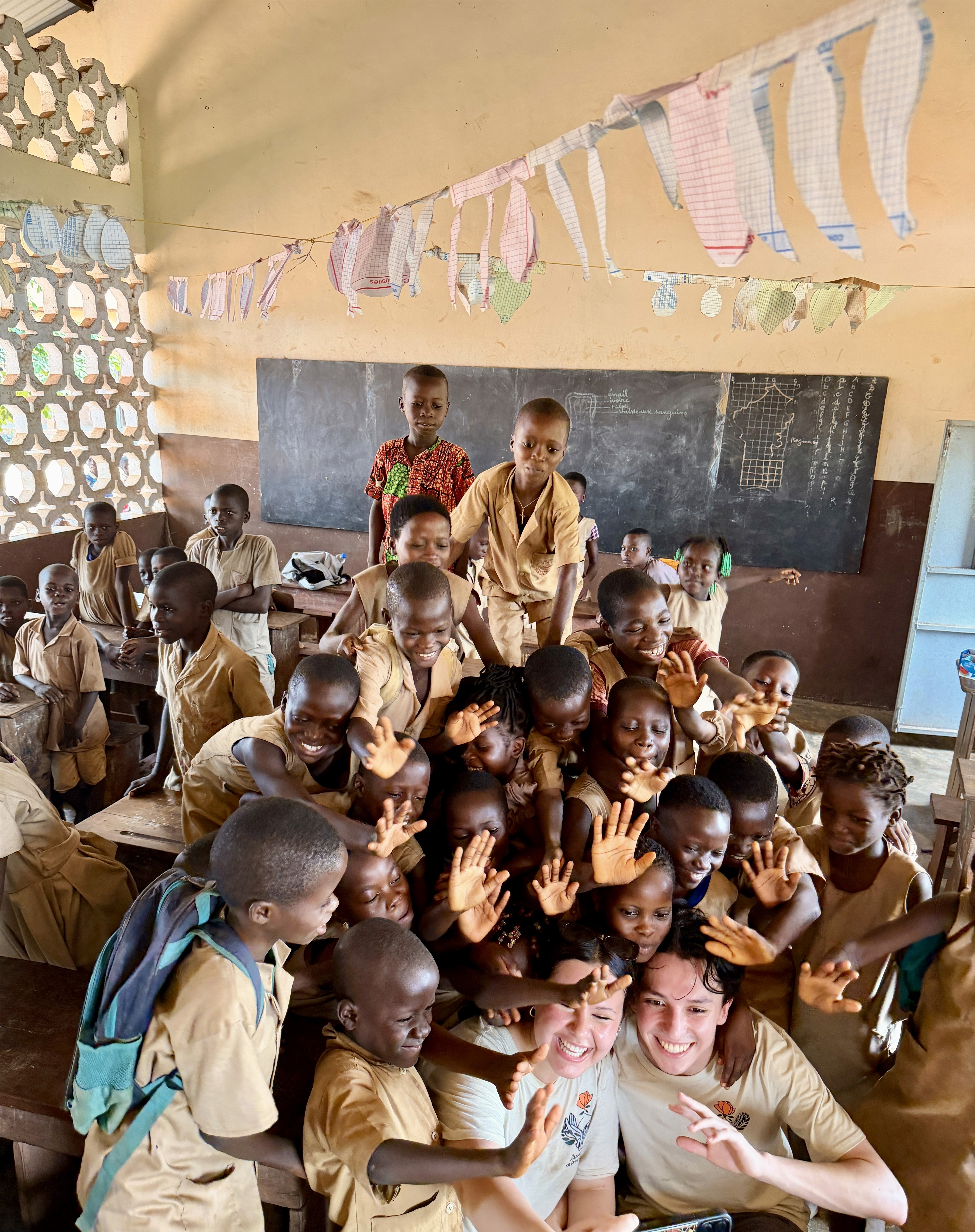 woman sitting around table holding tablet