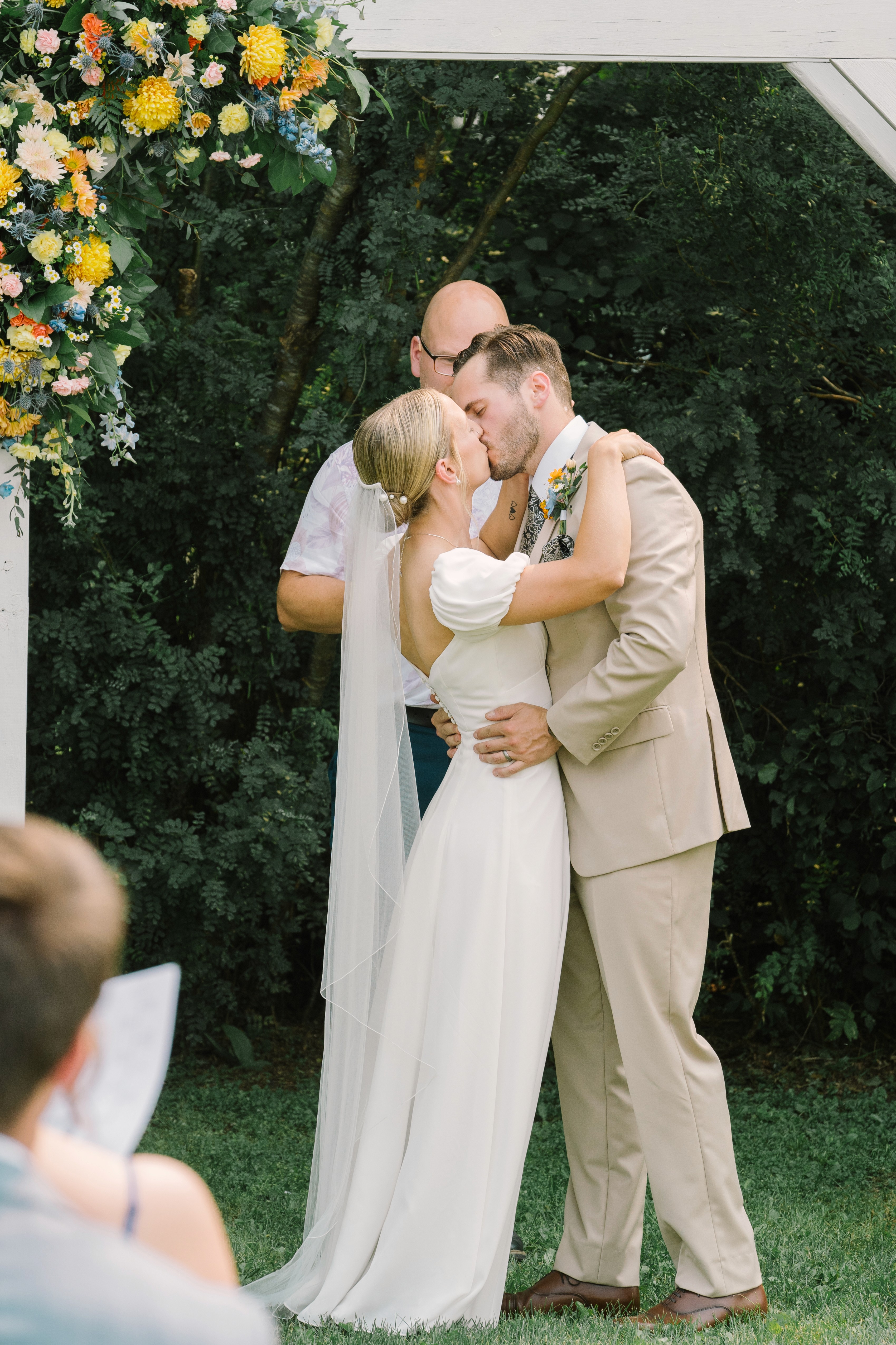 Brandon Manitoba wedding ceremony kiss celebration outdoor Winnipeg Trident Studios