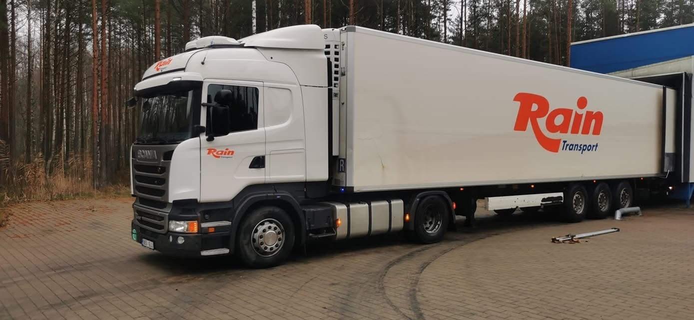 White Rain Transport truck with a refrigerated semi-trailer