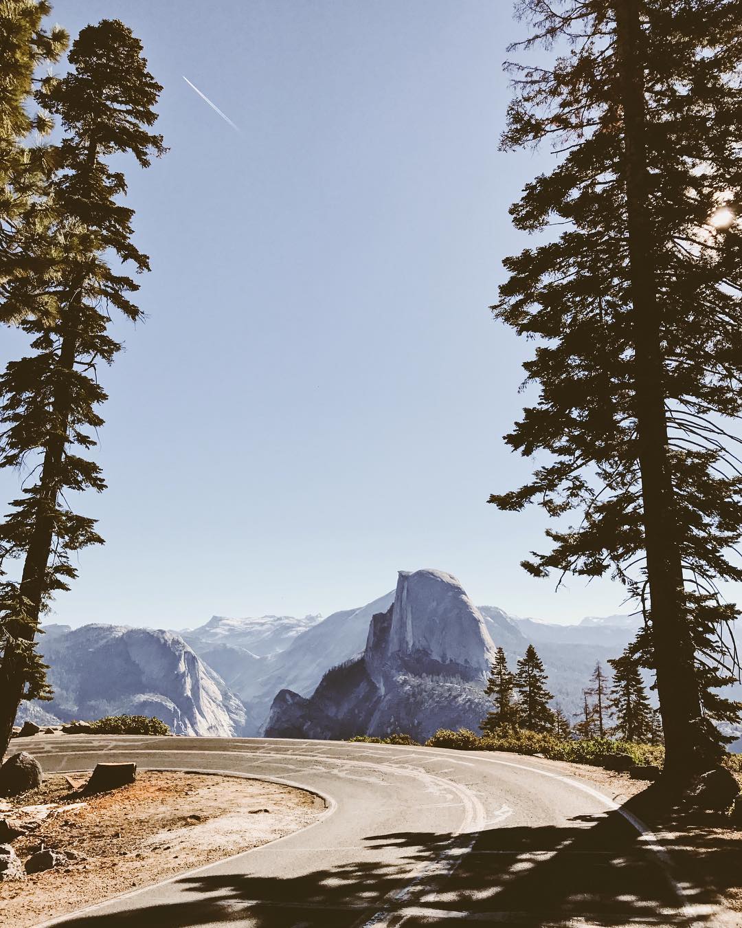 a group of people walking on a sidewalk
