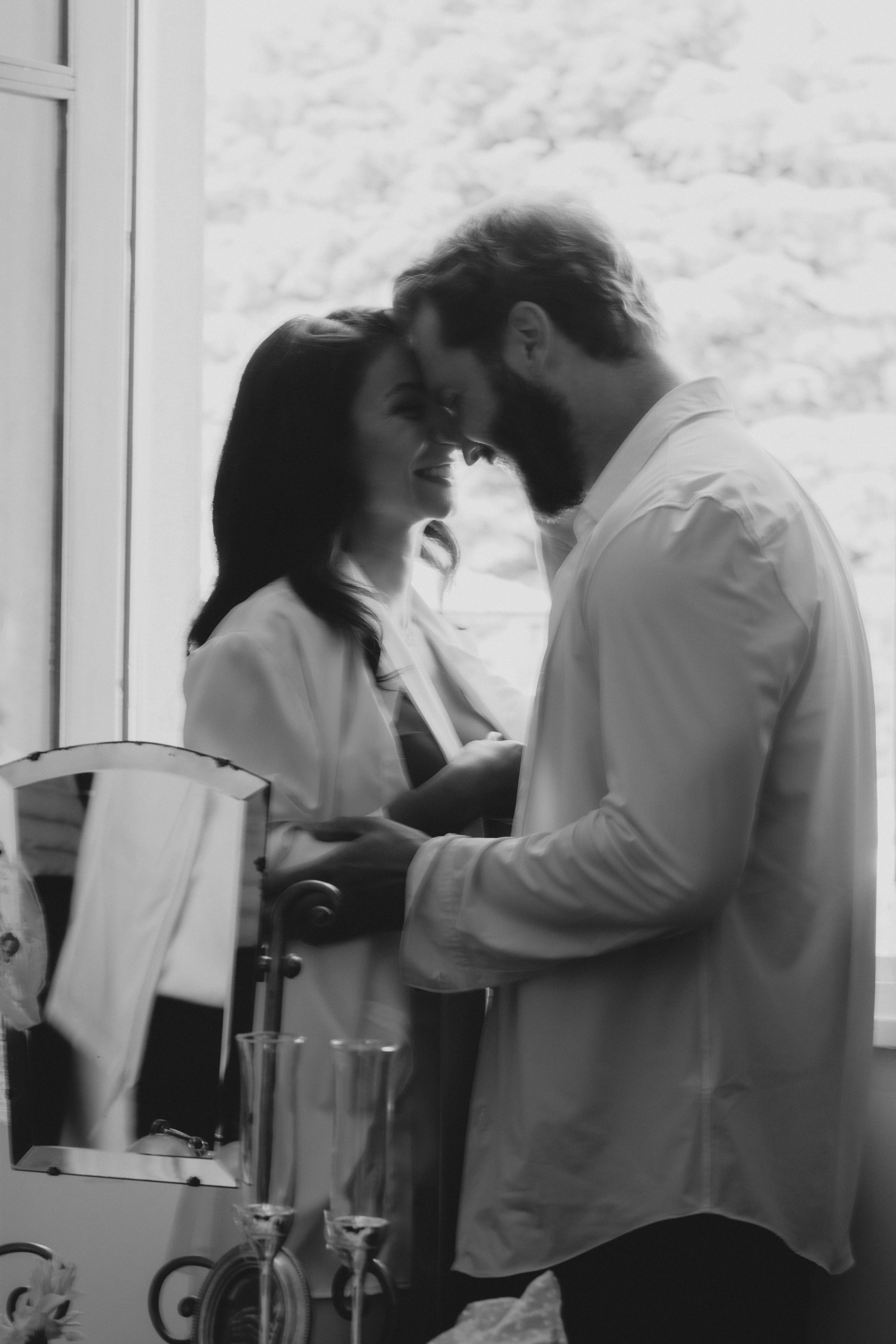 Minimalist floral branch with white flowers and yellow centers casting soft shadows