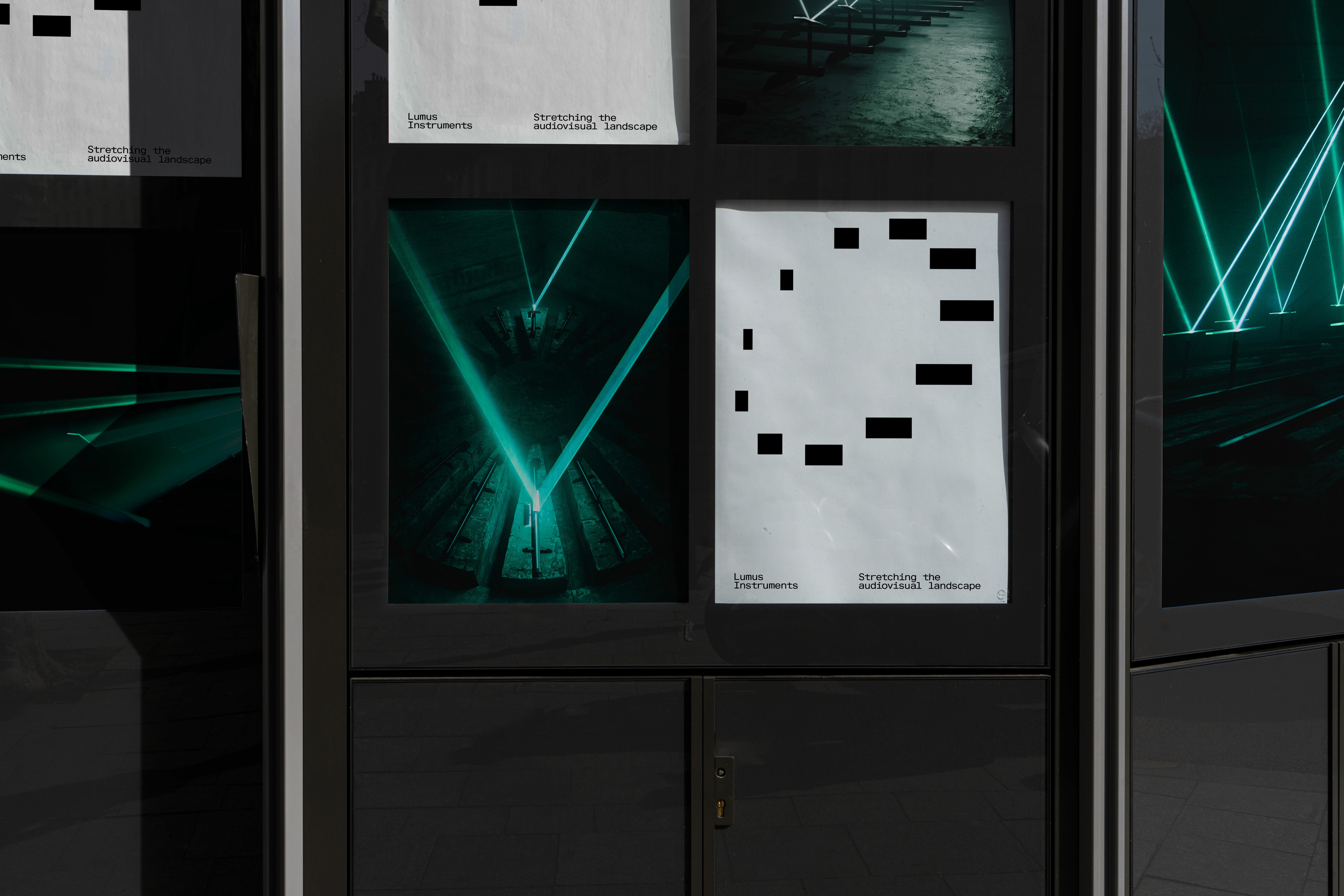 lumus instruments logo and installations on a poster wall