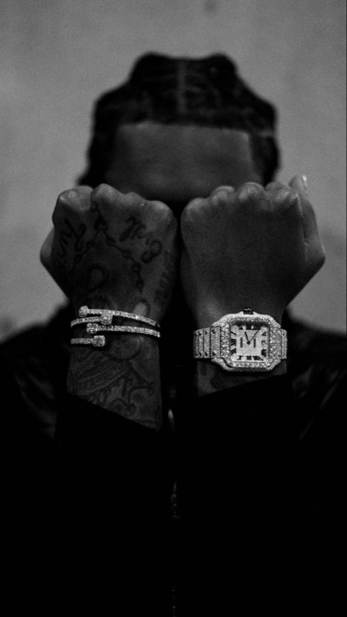 Model wearing ornate vintage-inspired rings, hands raised to frame her face against a soft tonal backdrop