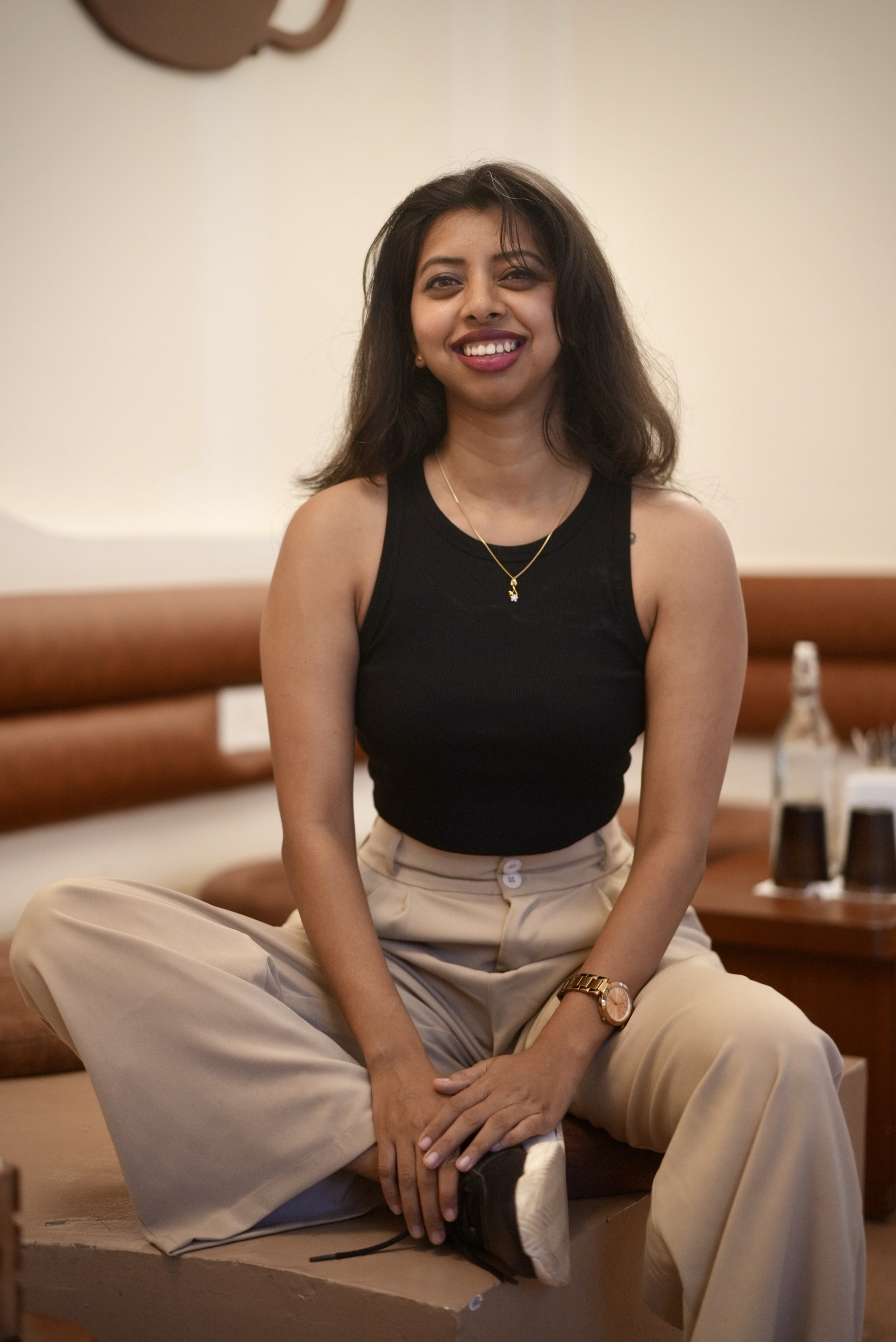 Teja sitting in a cafe