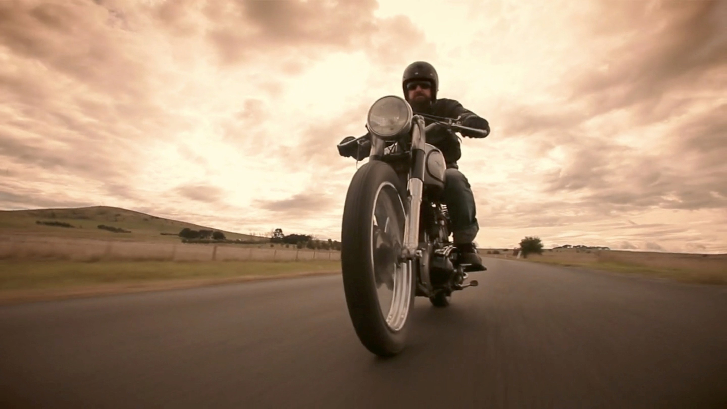 low angle man on nmotorcycle