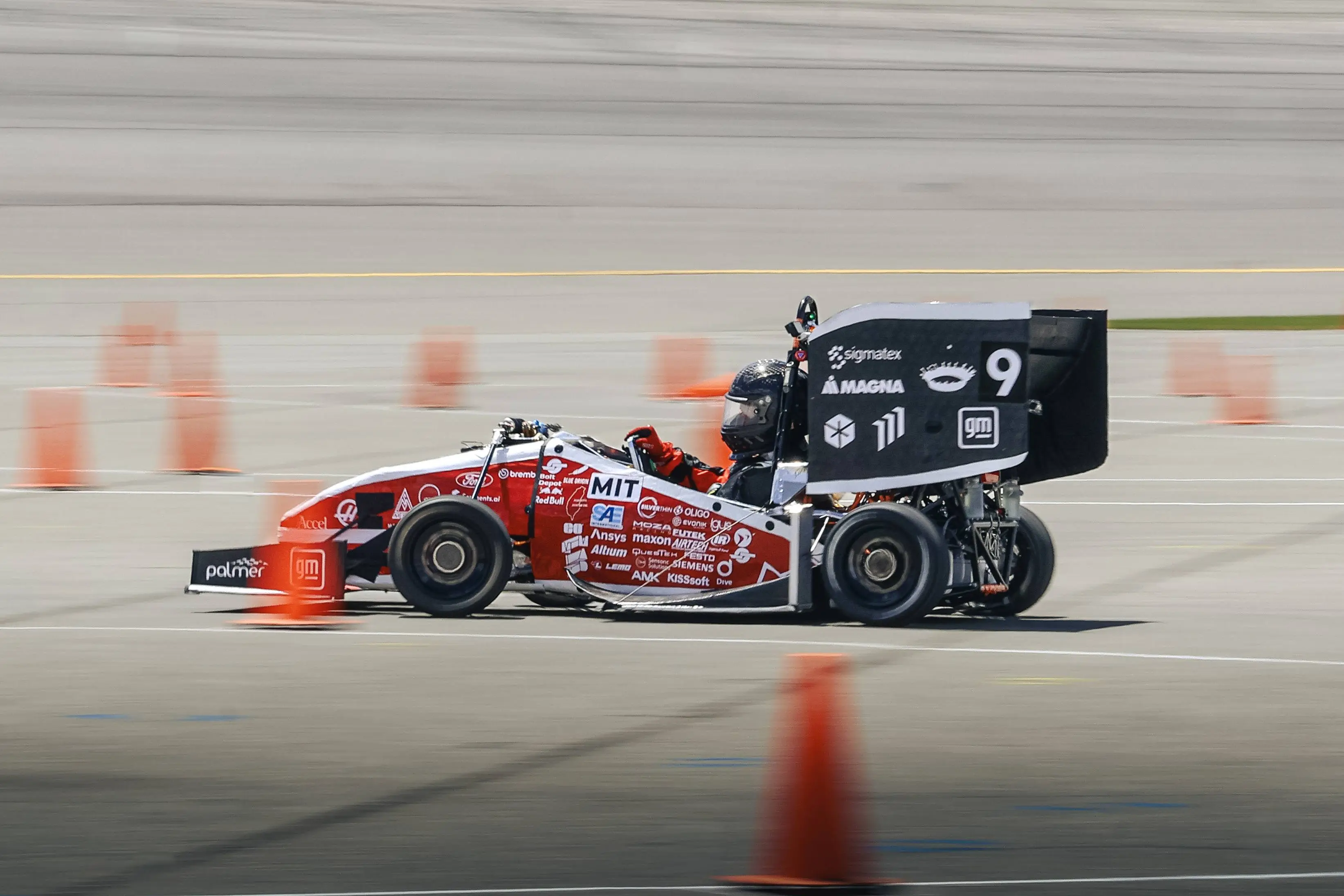 MIT Motorsports electric Formula SAE race car at speed during competition