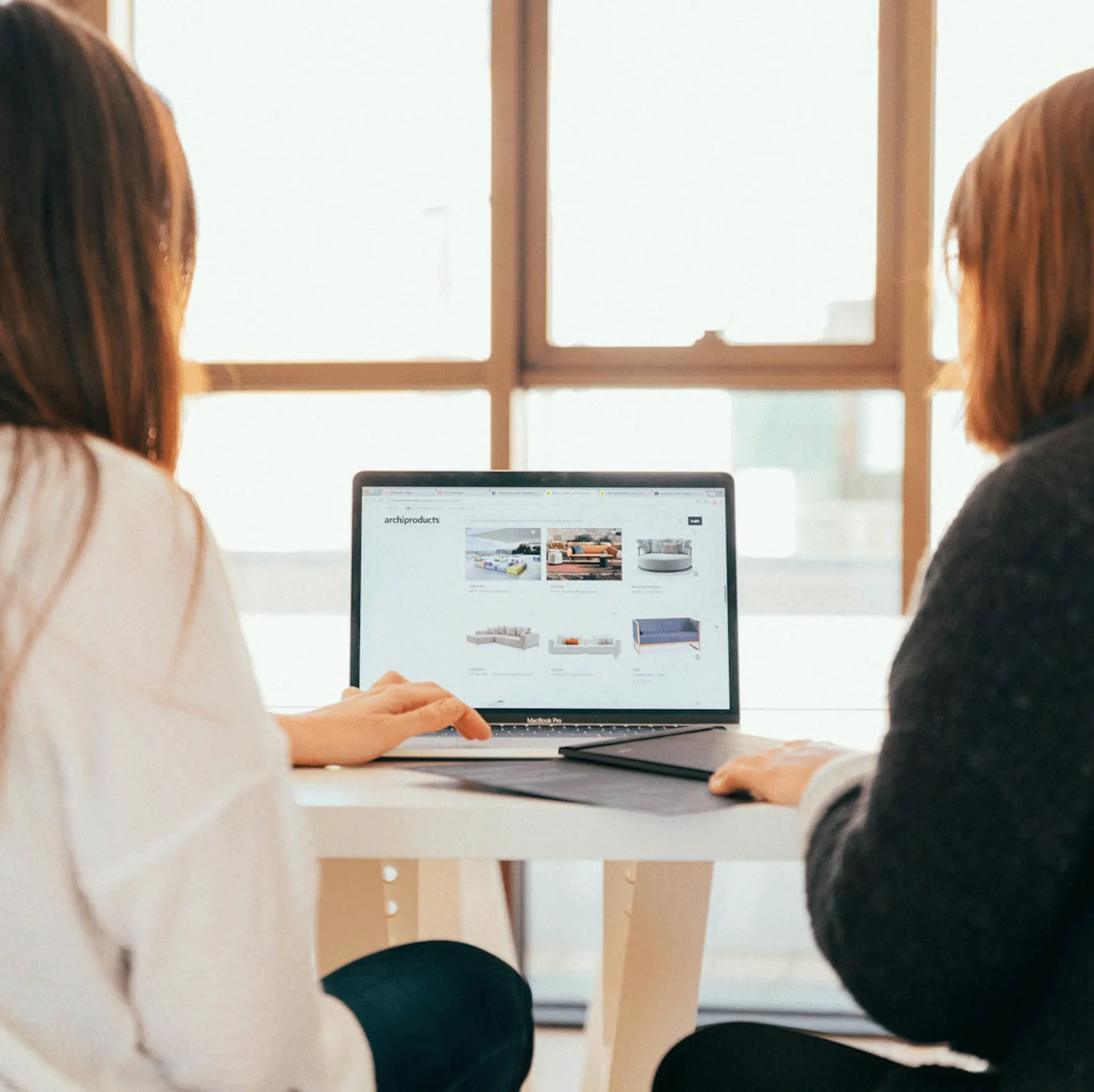 two females working on a coaching leadership style