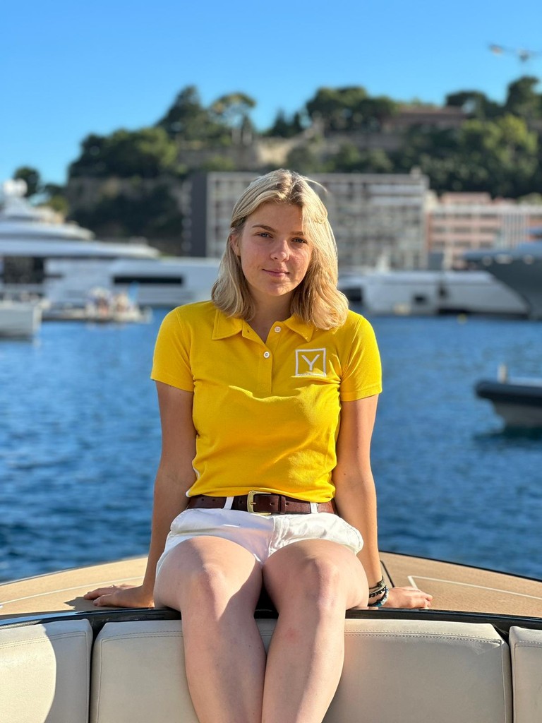 a blurry photo of a person standing in front of a wall