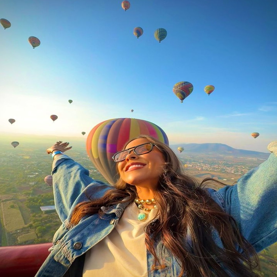 A close-up shot of a handcrafted welcome cocktail served at a Mediterranean hotel patio