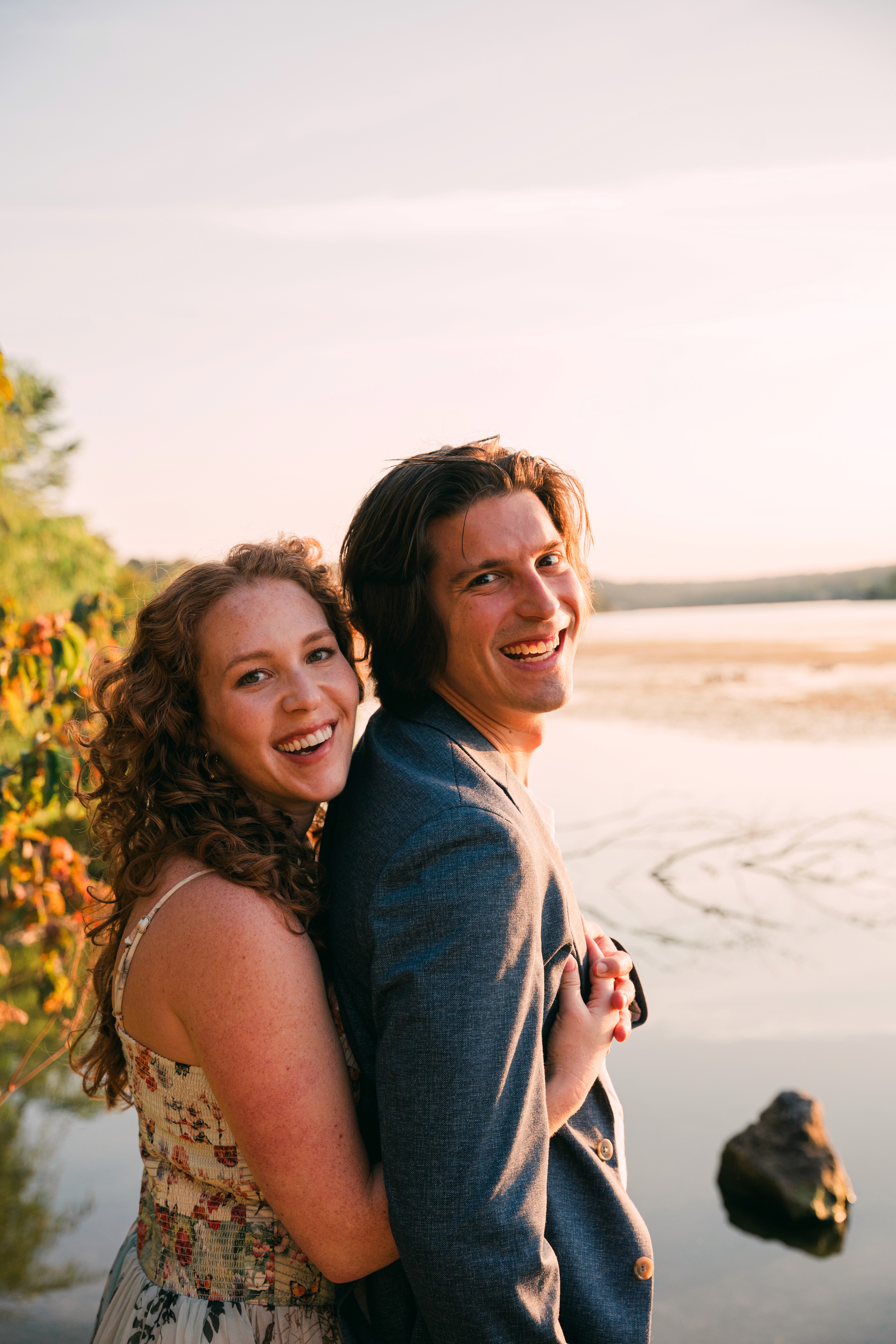Couple portrait with dog on field