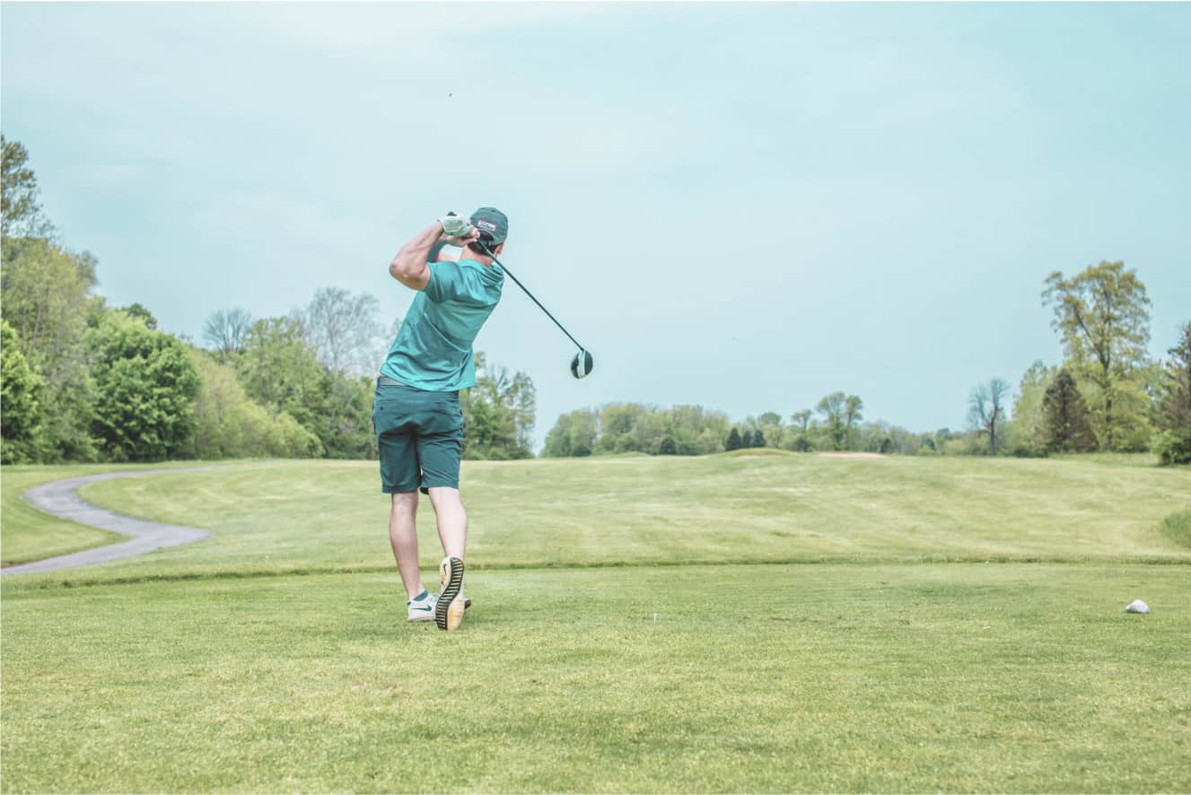 Man playing golf with a drive