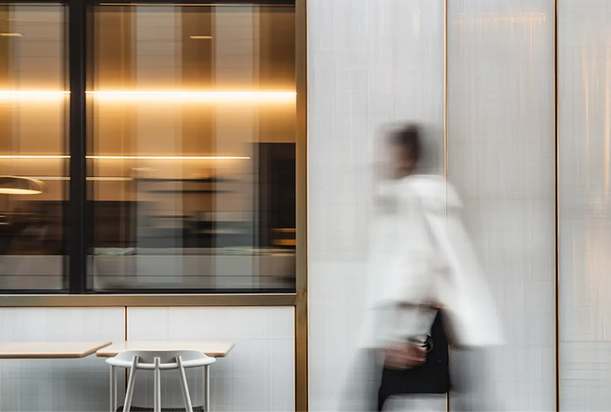 a person walking through a cafe