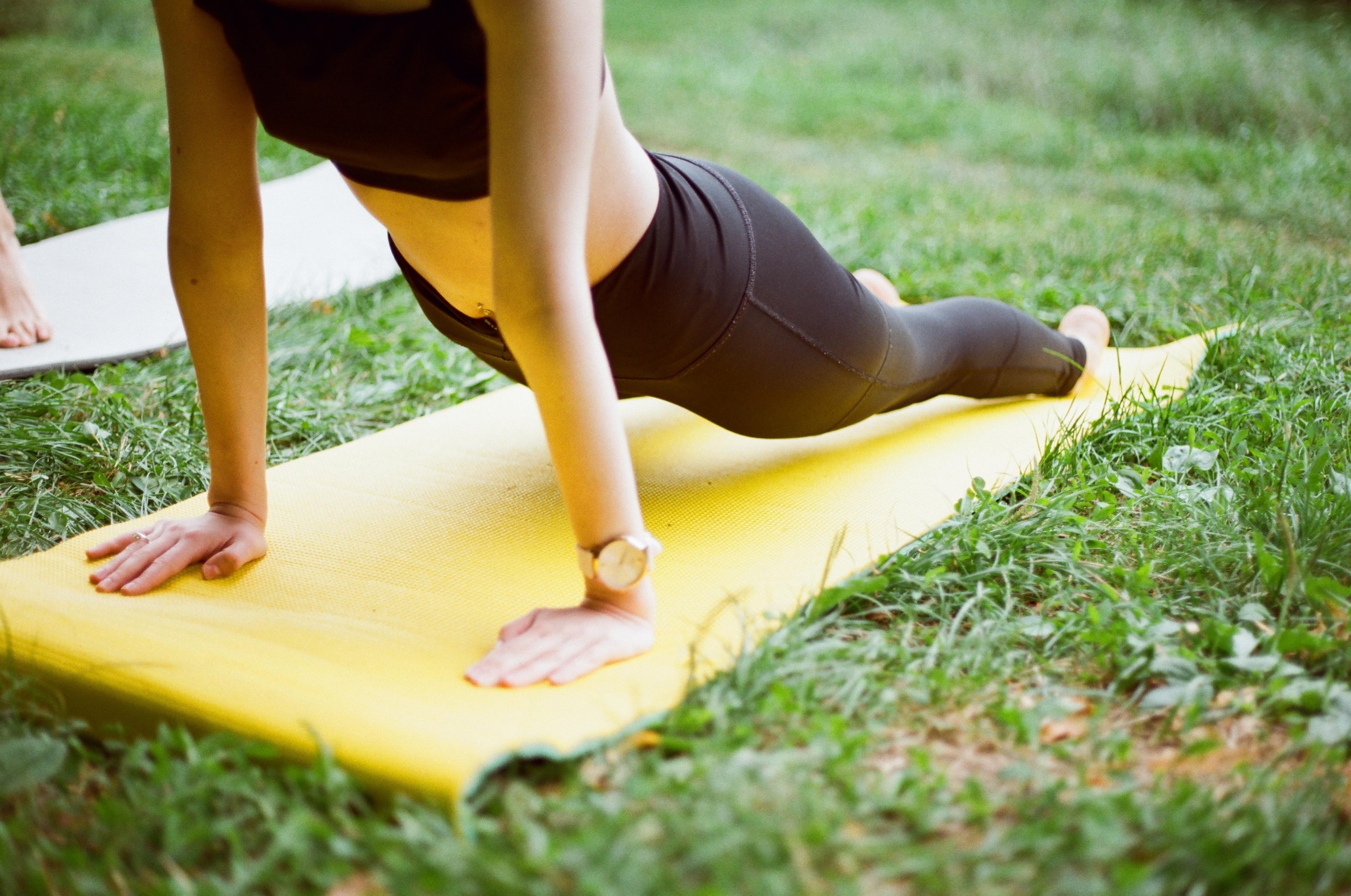 Graceful woman engaged in a rejuvenating yoga pose, embodying the essence and holistic benefits of wellness retreats.