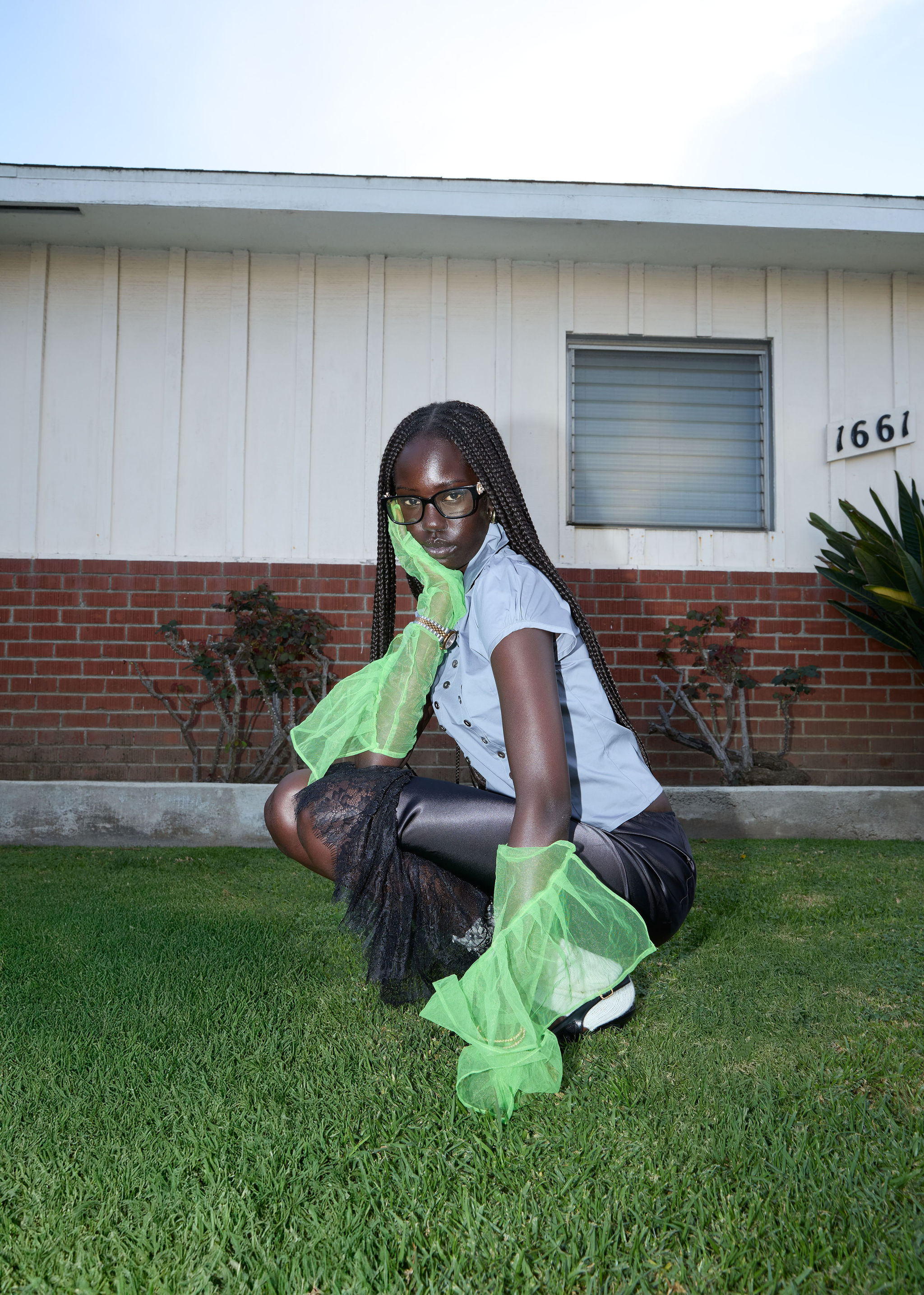 Woman walking on a curved pavement with shadow.