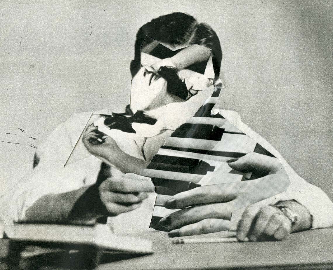 A black and white photograph of a person wearing a mask with a striped pattern. The mask covers the upper face and extends down the neck. The person wears a white long-sleeved shirt and a dark bow tie. Their hands are visible, one resting on a surface and the other near their face. The background is a plain light-colored wall.