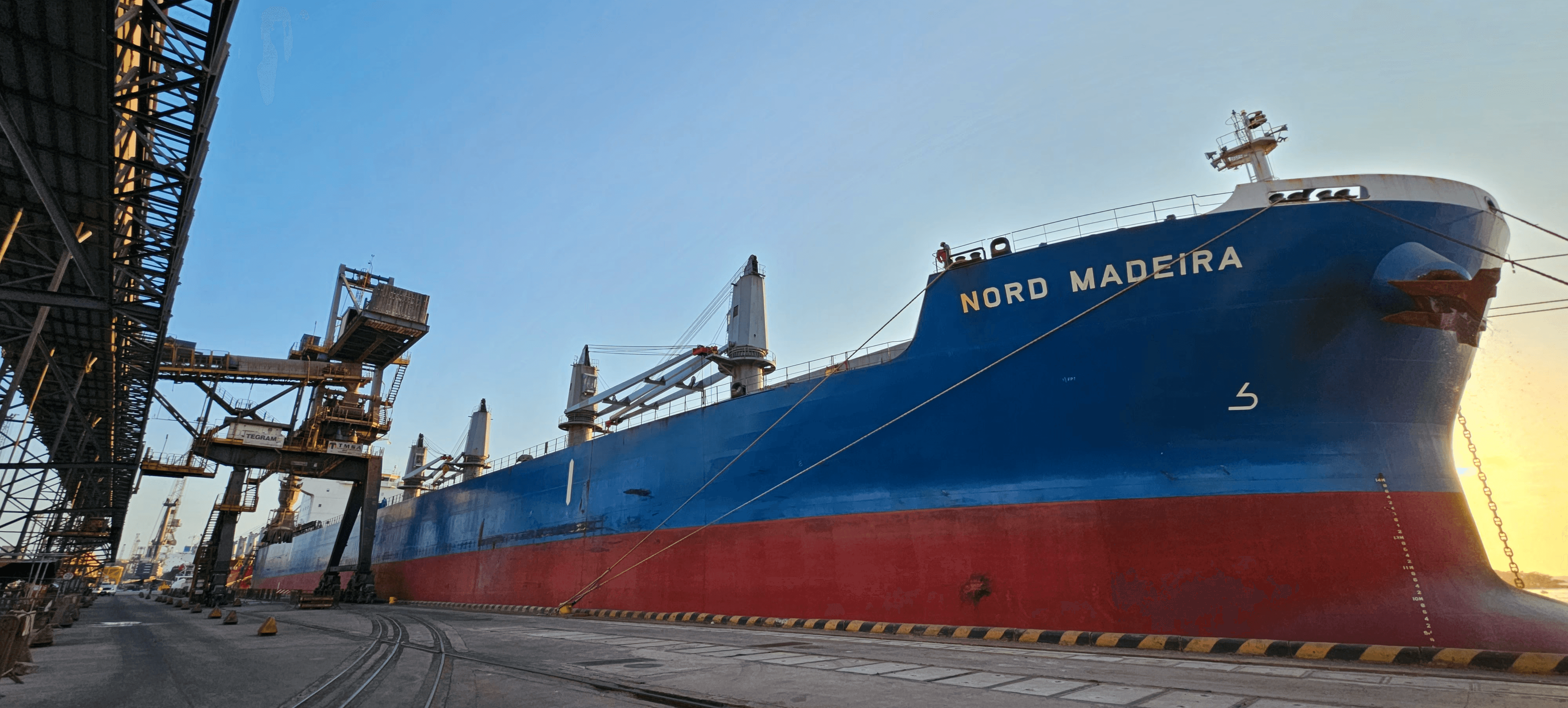 Bulk carrier Nord Madeira berthed at Port of Itaqui, Brazil, during cargo operations, representing CARGOWARD® maritime cleaning, shipping agency and marine survey services.
