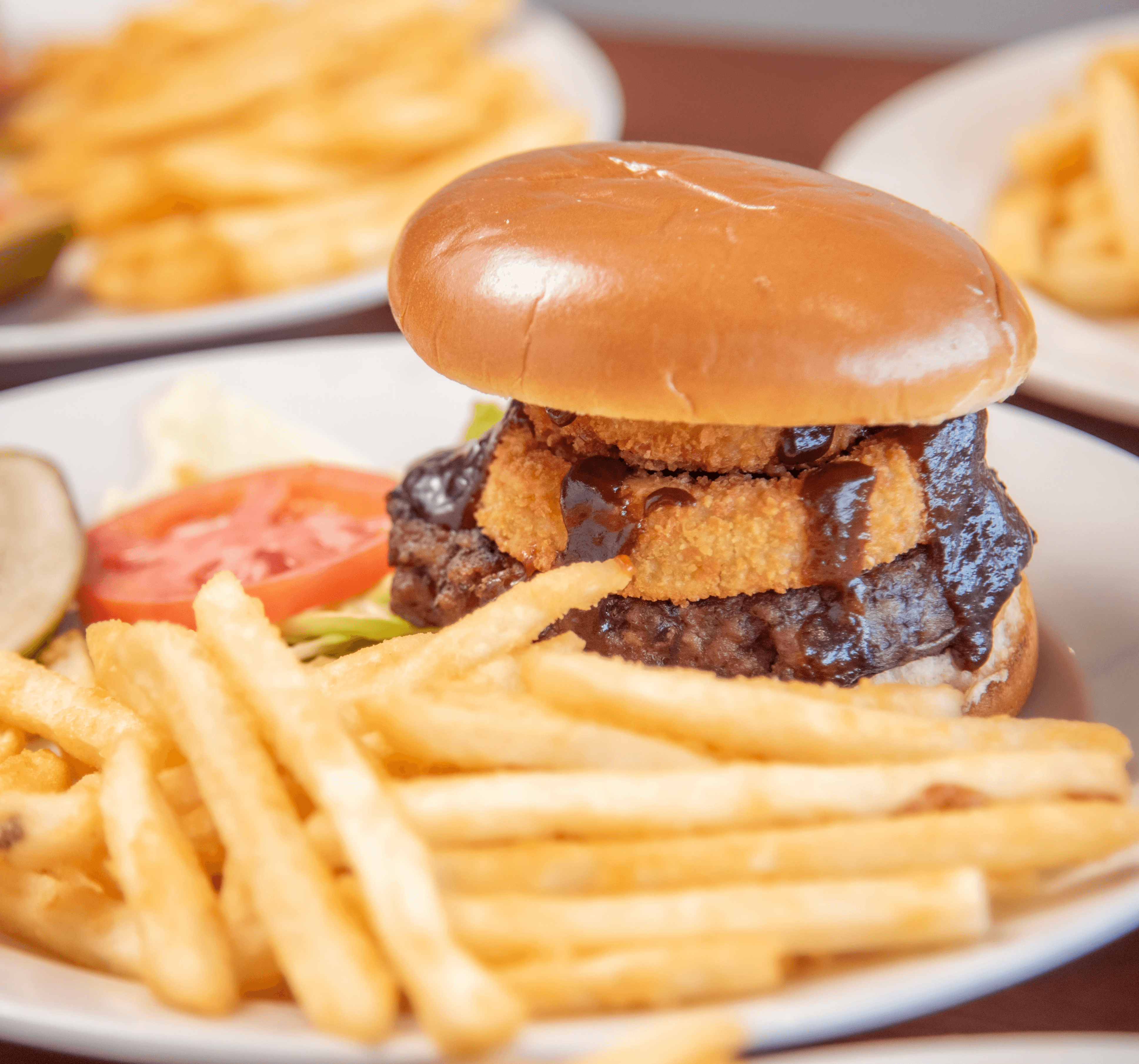 a hamburger and french fries on a table