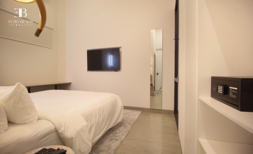 Contemporary kitchen and living space within the Bali Canggu Echo Beach Suite apartment, perfect for groups needing a three bathroom layout.