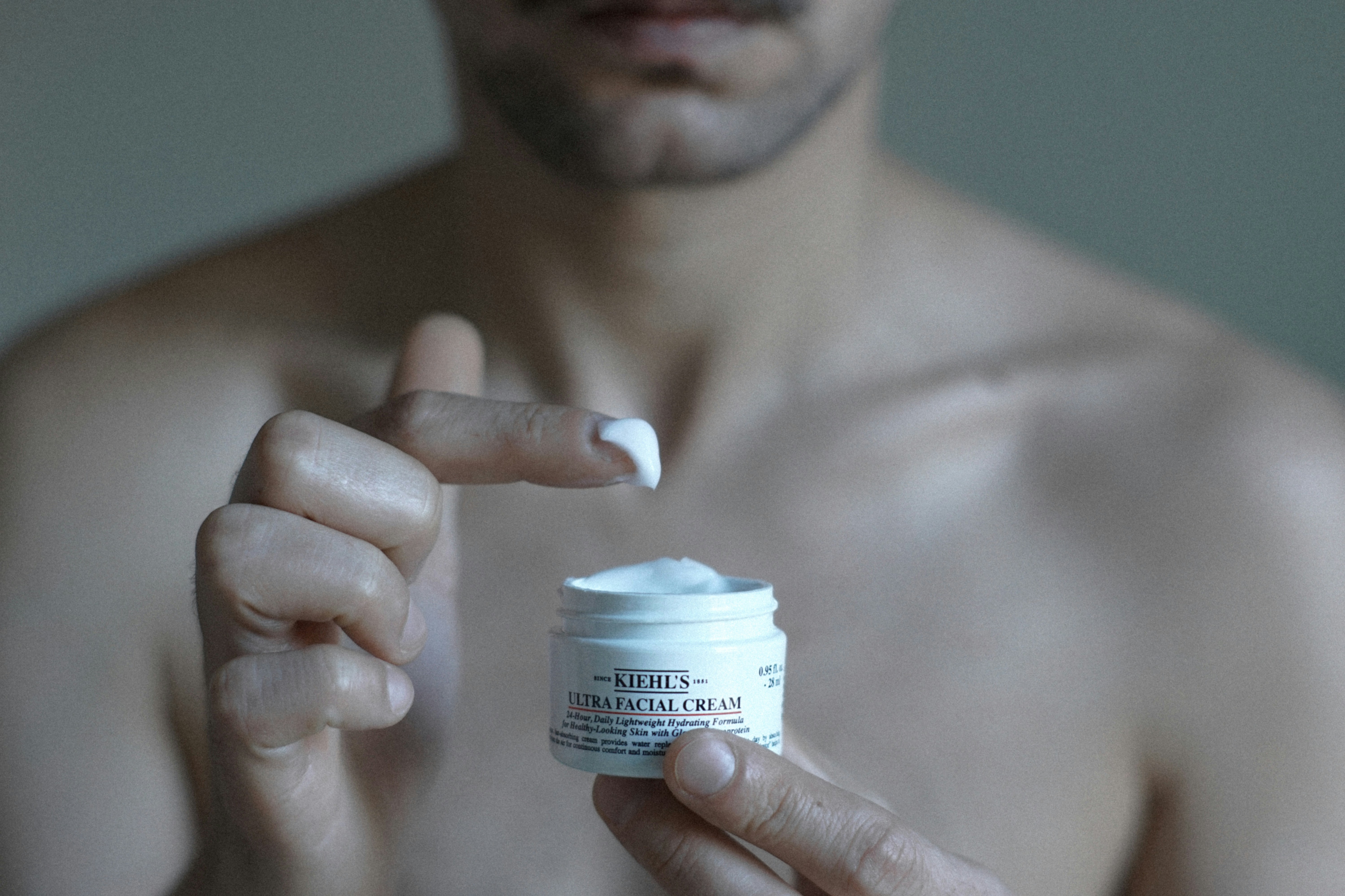 man with skin cream - Best Skincare For Men