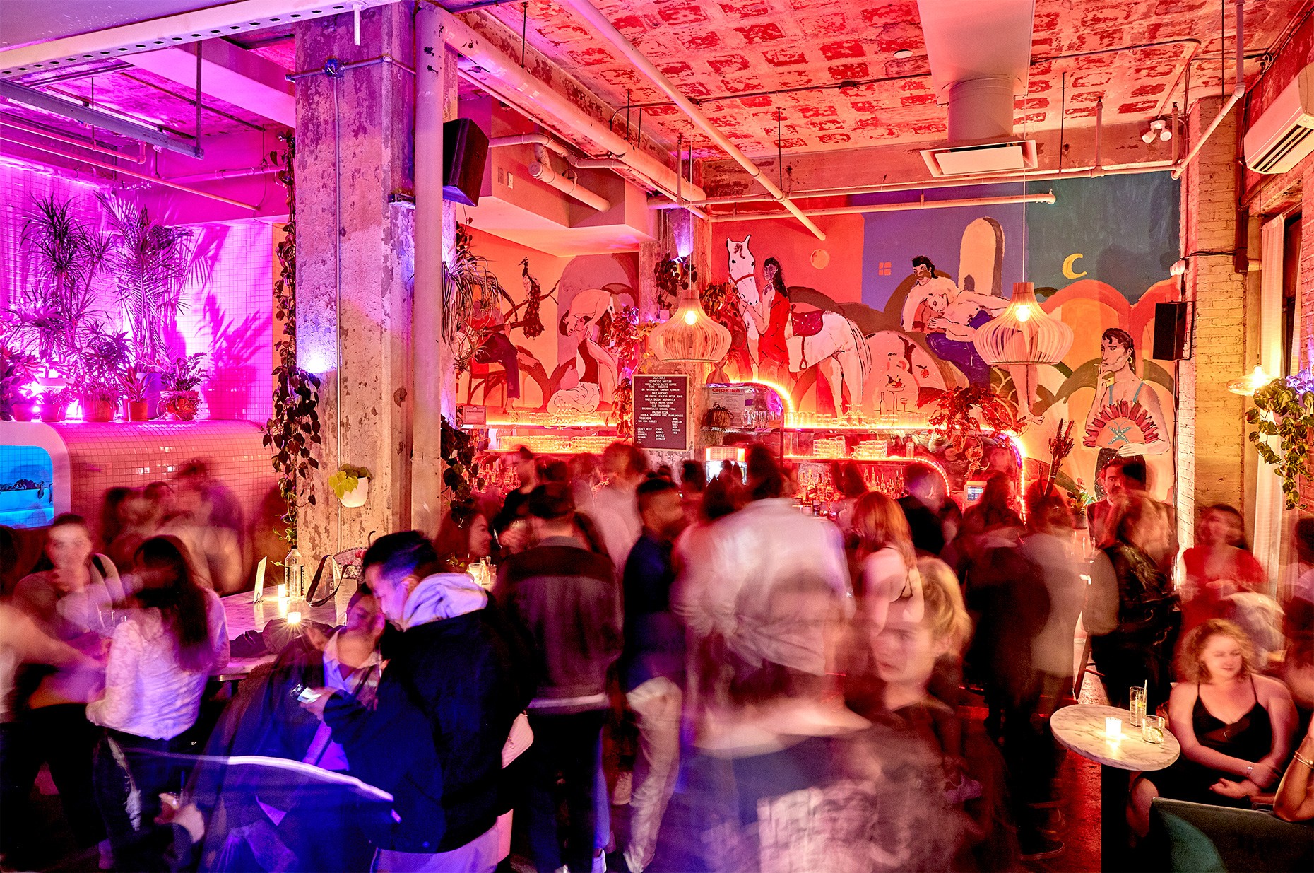 Two chefs behind the kitchen counter