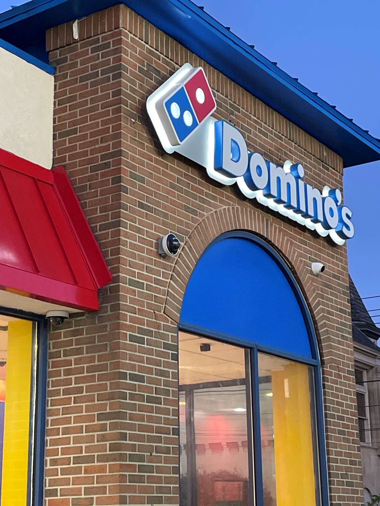 man sitting beside woman looking at a contract on DocuSign