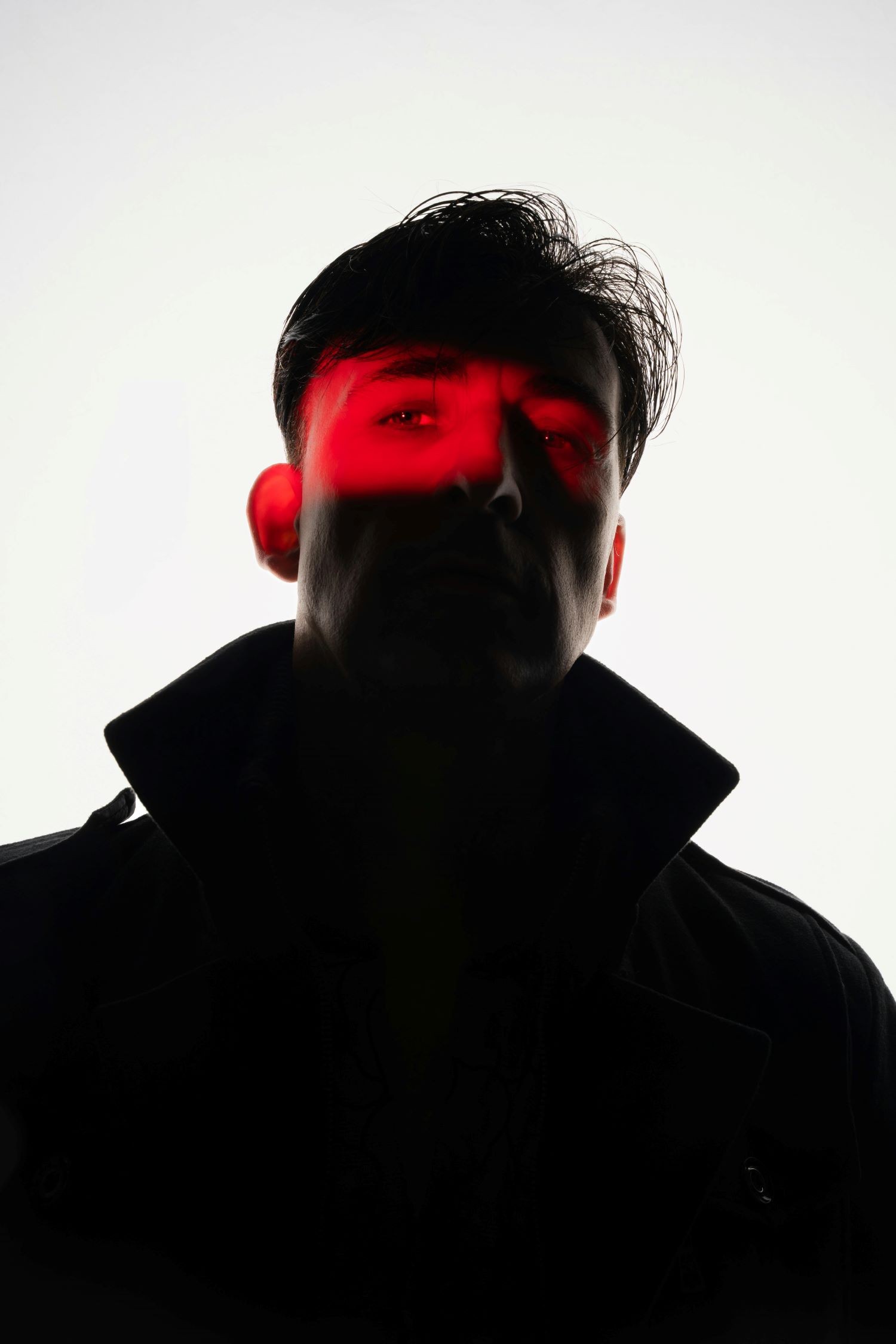 Creative man portrait with red lighting
