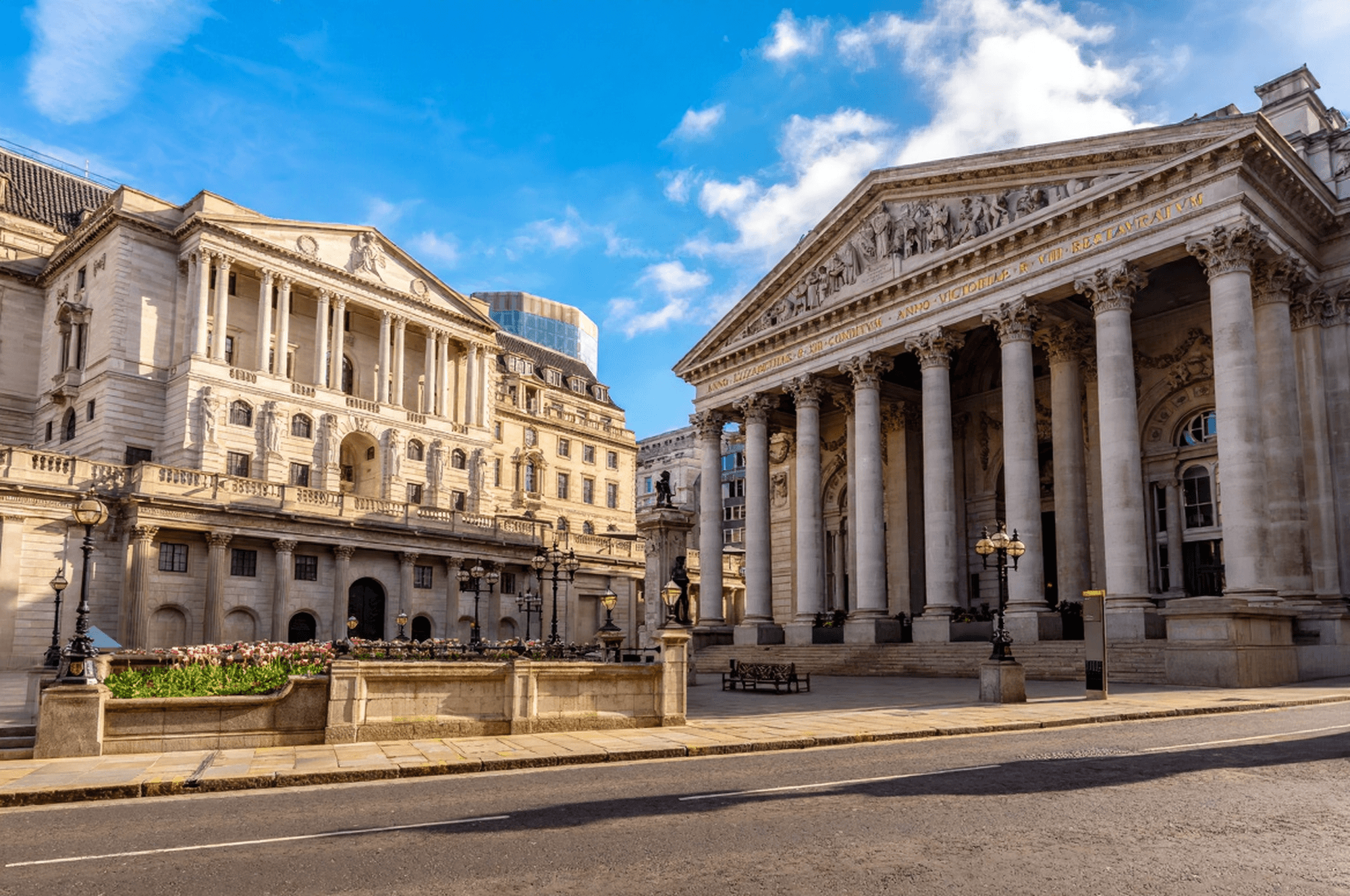 A stone bridge and classical temple at Stourhead Gardens, representing legacy, structure, and enduring continuity.