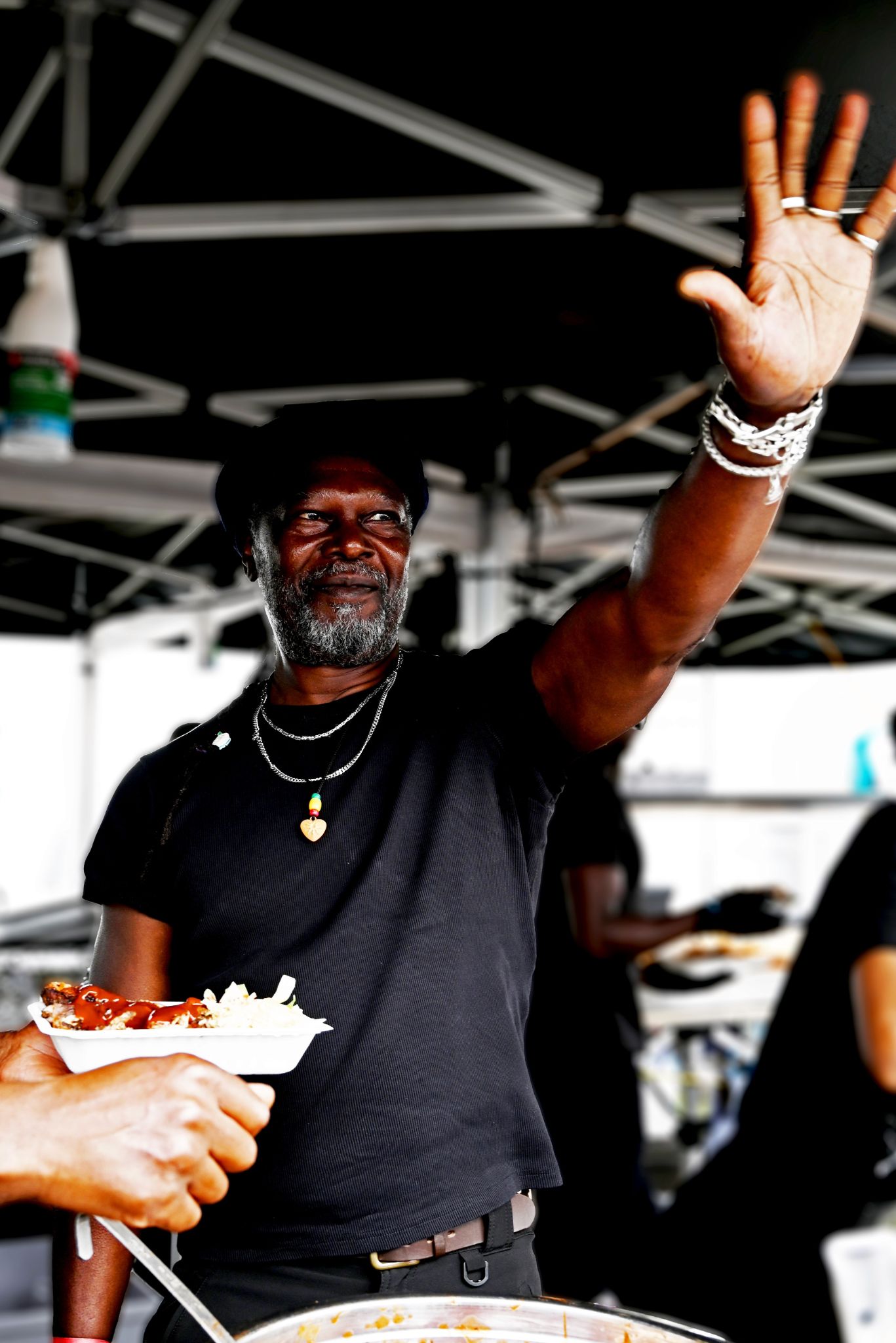 Levi Roots waving at a crowd