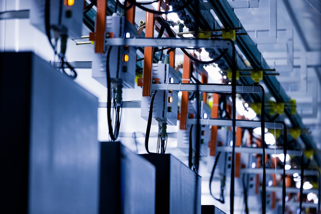 rows of computer servers in a data center, glowing blue and green status lights, cooling fans visible, clean and organized technological environment