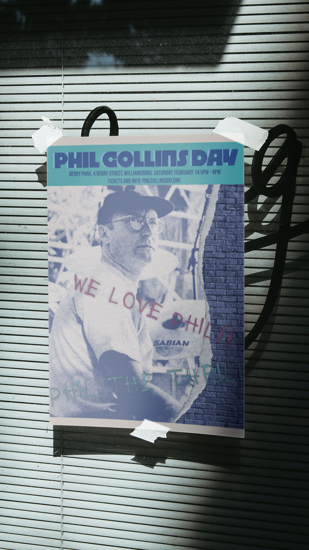 Poster design for a Phil Collins Day event featuring a blue halftone portrait collage with torn-paper textures, graffiti-style handwritten text reading “We Love Phil!!!,” and event details across the top against a teal banner and brick wall background.