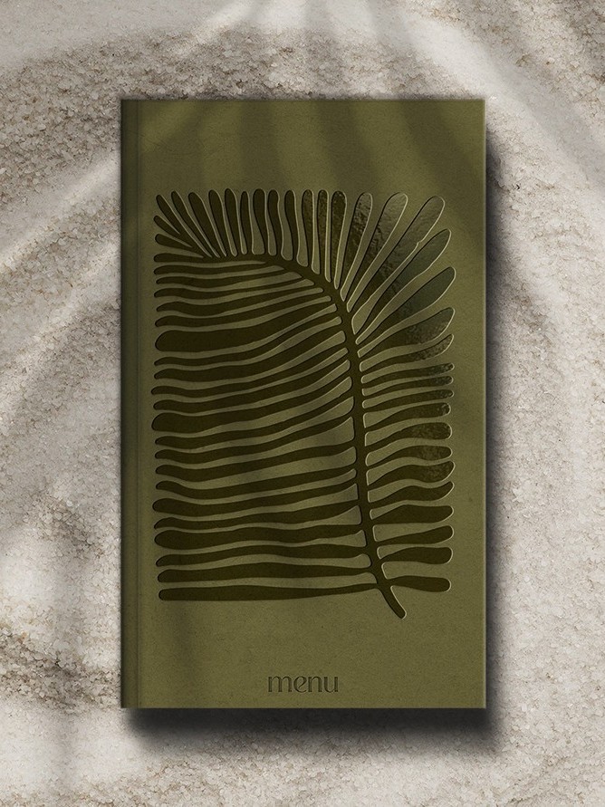 Menu Design placed on sand, seaside Kochili All-Day Experience