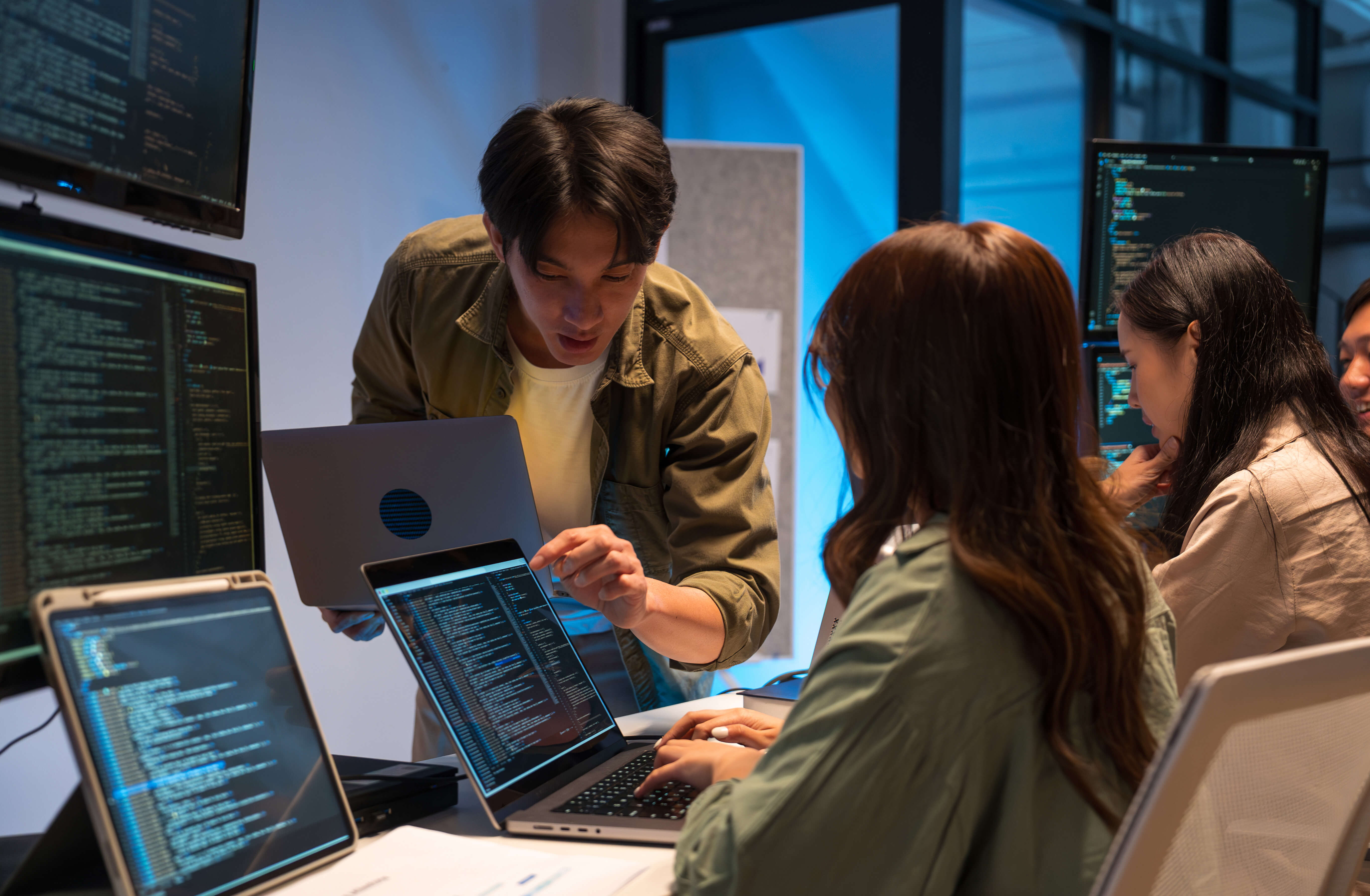 A schoolgirl stands outdoors holding books in one hand and a coffee cup in the other.