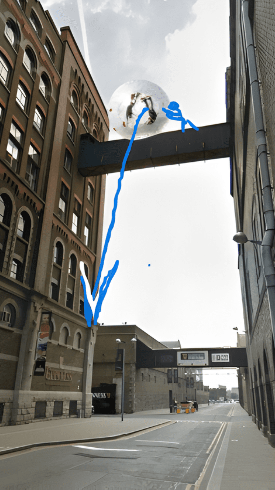 A conceptual mockup shows a circular bubble falling from an urban skywalk toward the street